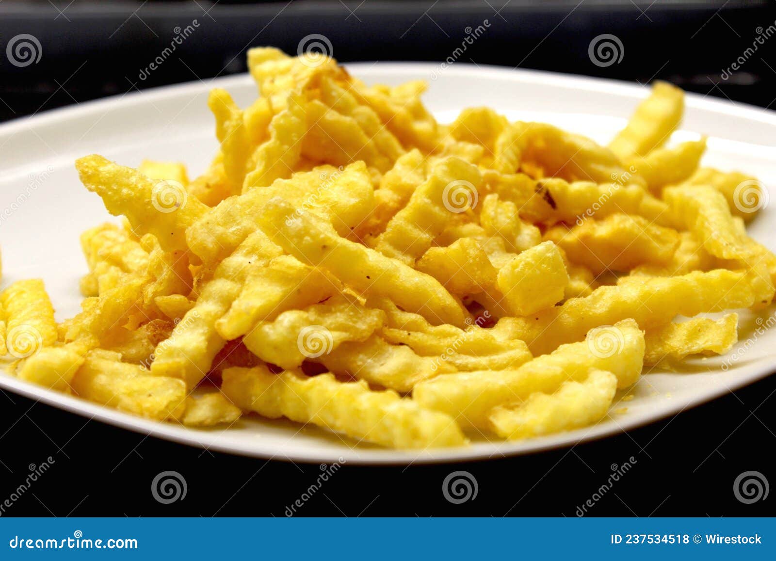 Closeup Shot of a Plate of Textured French Fries Stock Photo - Image of ...