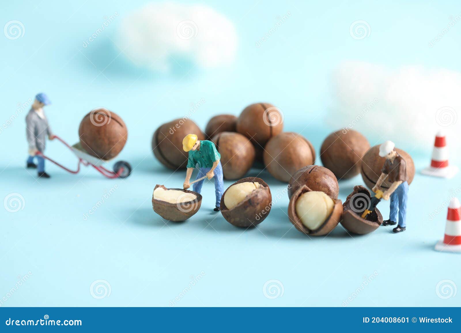 closeup shot of small construction workers working on nuts