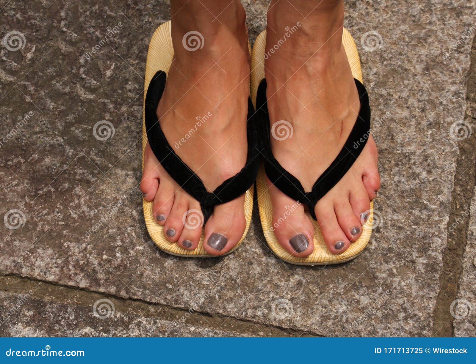 Closeup Shot of a Woman S Legs Wearing Flip-flops Stock Image - Image ...