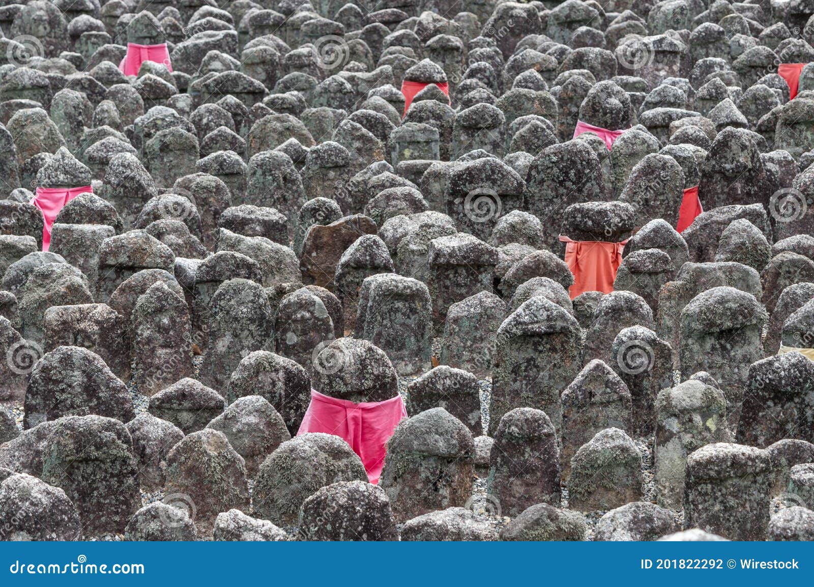 closeup of the small stone statues at the adashino-nenbutsuji buddhist temple in kyoto, japan