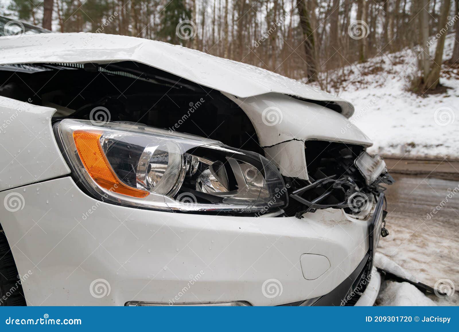 Closeup Of Smashed Car After Accident. Broken Front Of The Vehicle