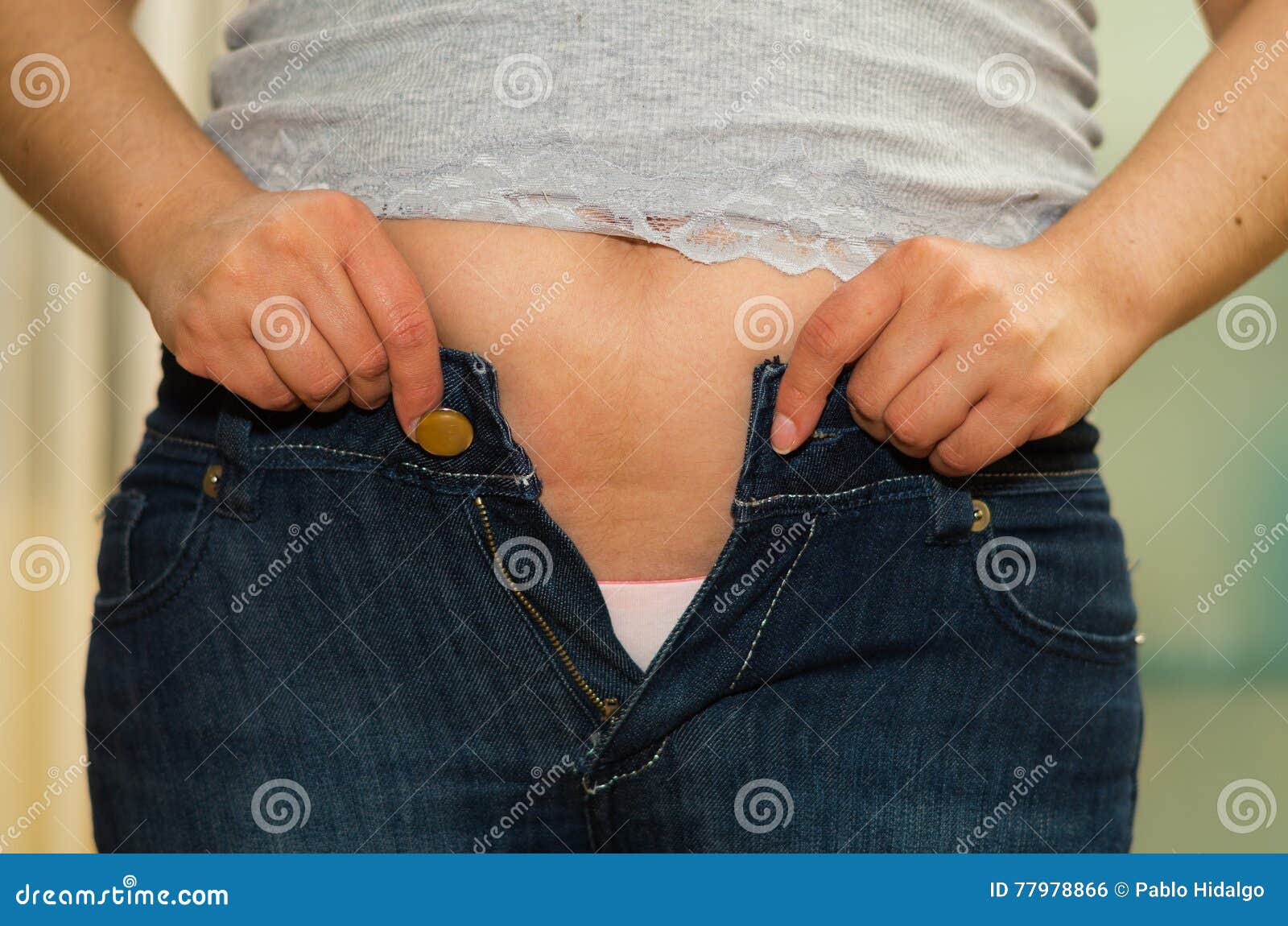 Closeup Stomach Woman with Jeans Unzipped, Hands Holding Onto Edges of  Pants, Pink Underwear Visible and Naked Lower Stock Photo - Image of  abdomen, measurement: 77978866