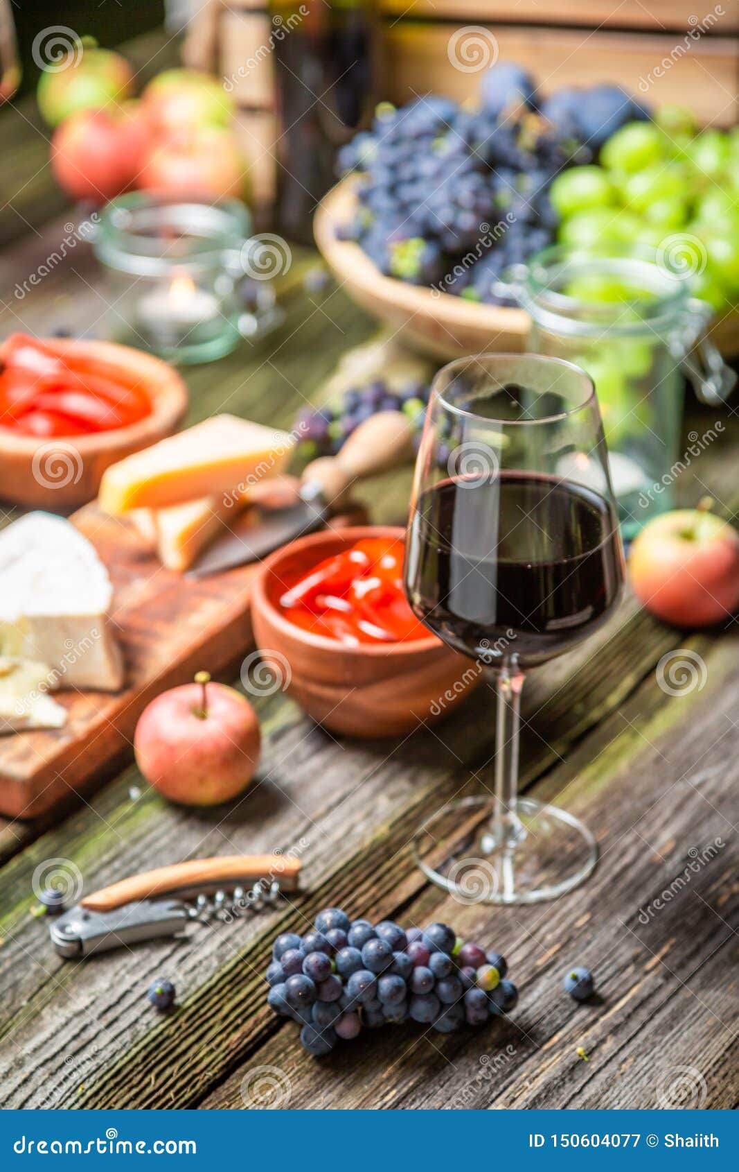 Closeup of Supper with Appetizers and Wine in Illuminated Garden Stock