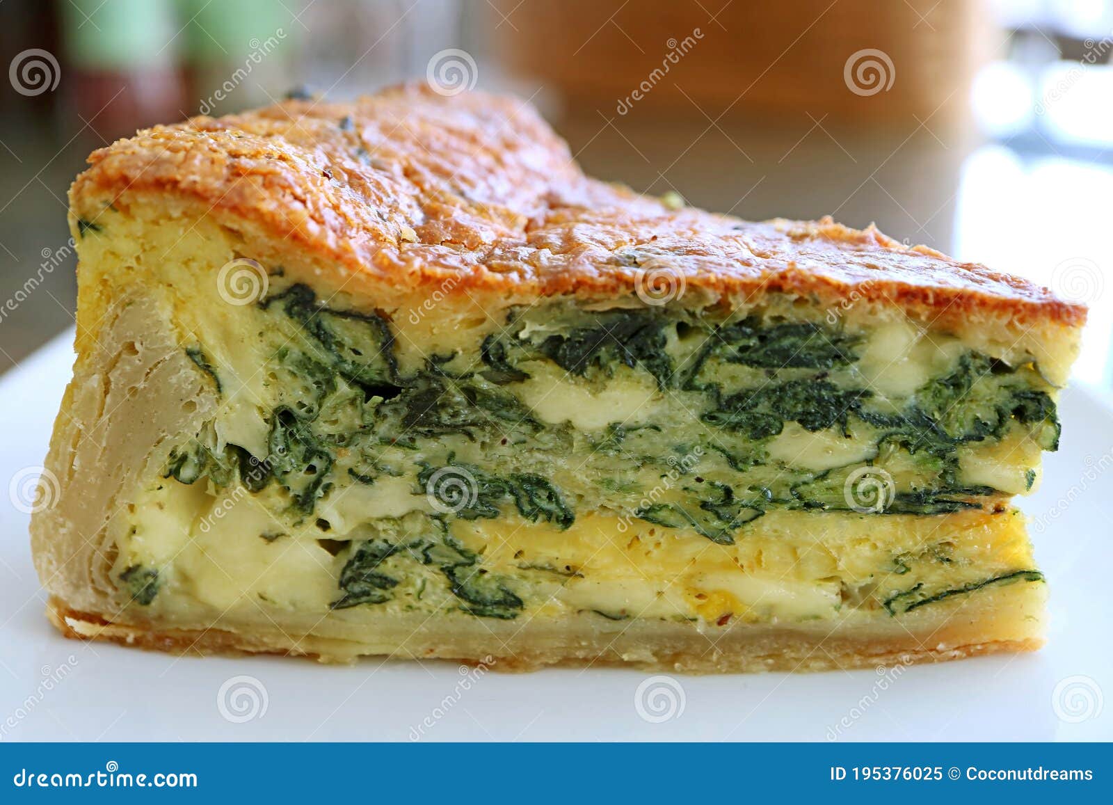 Closeup the Texture of a Slice of Homemade Spinach Quiche Stock Image