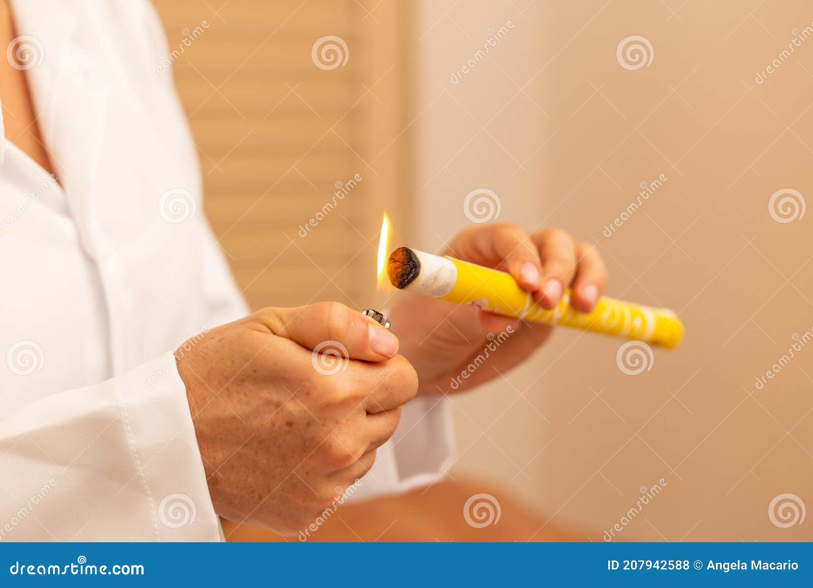 Closeup on Therapist Hands Lighting Up a Moxa. Stock Photo Image of