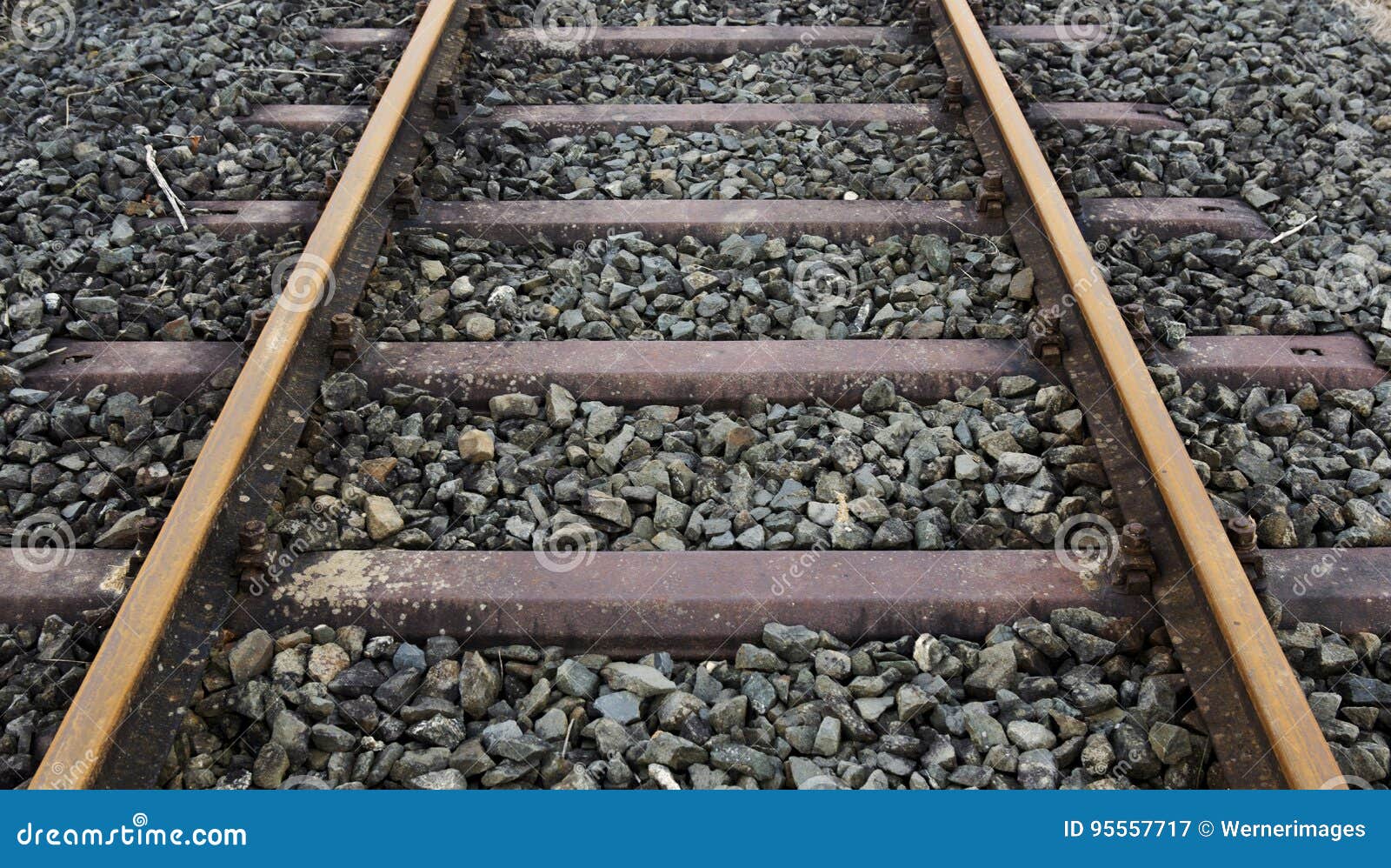 A Closeup Of Two Old Train Couplers Connected Together With Railroad