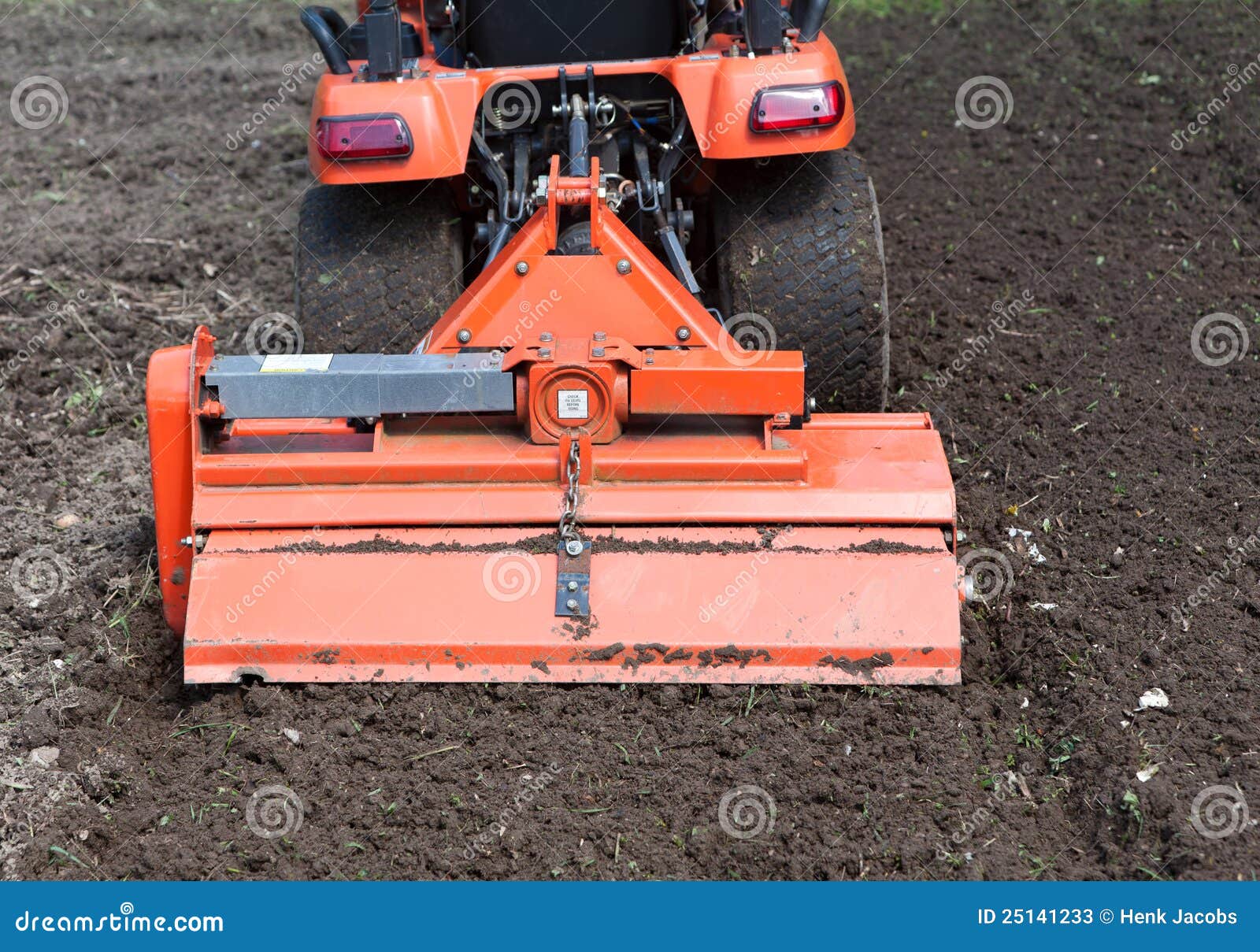 closeup of utility tractor's tiller attachment