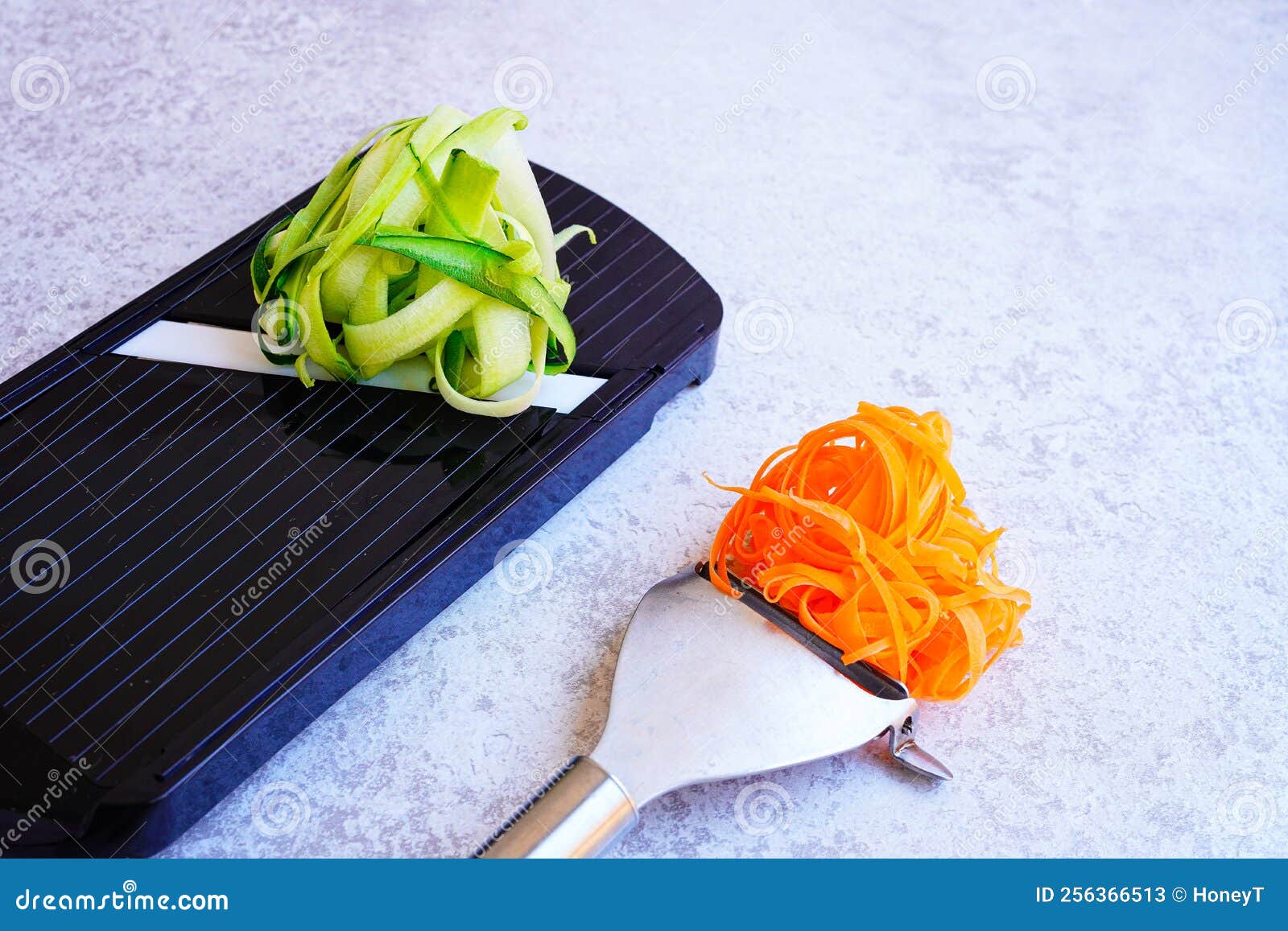 Closeup of Vegetable Slicer with Zucchini and Peeler with Carrot