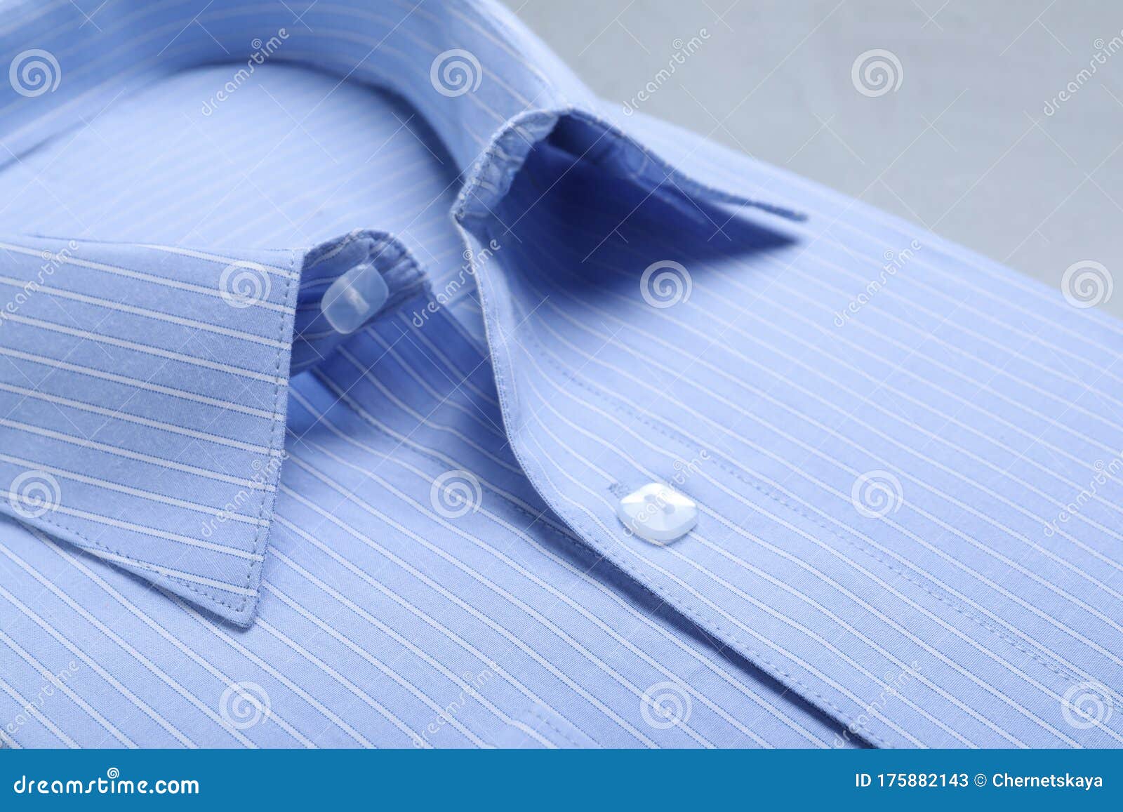 closeup view of light blue shirt. dry-cleaning service