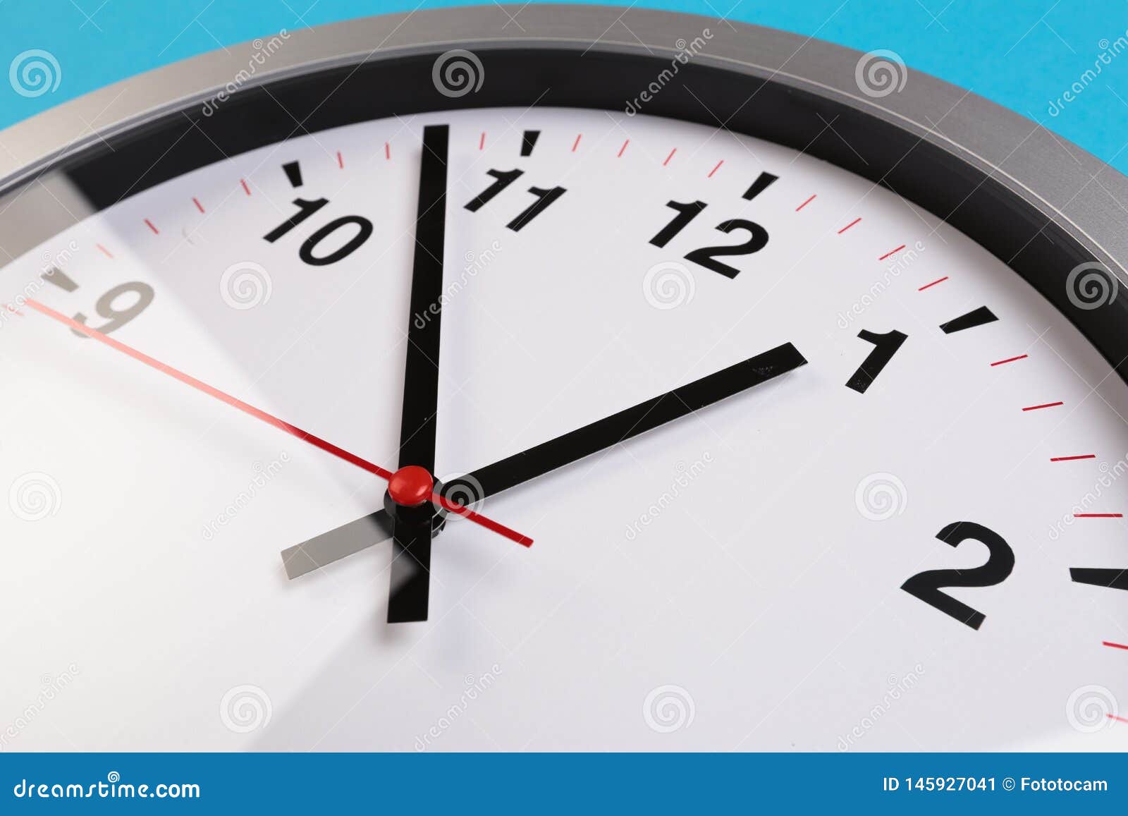 Closeup Wall Clock Set on Blue Background. the Concept of Stock Image