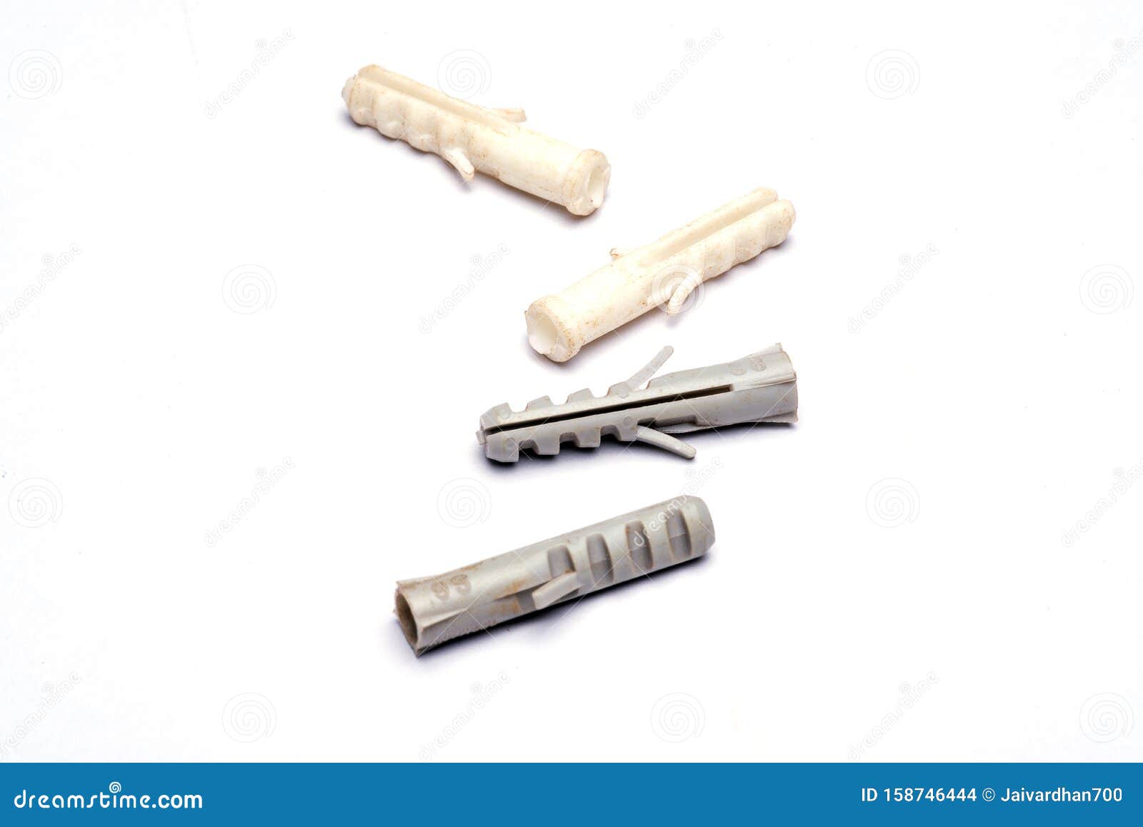 Closeup of Wall Nail Nylon Plugs in White Background Stock Photo