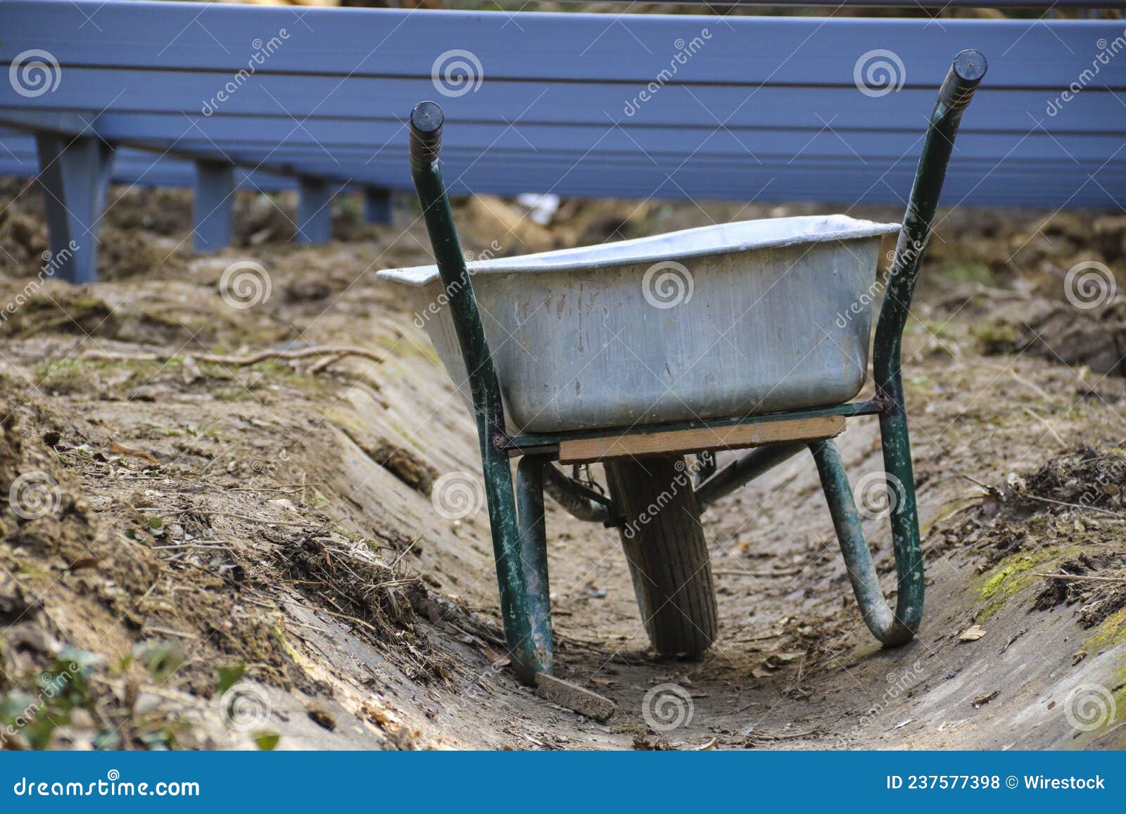 Closeup of the Wheelbarrow at the Construction Site. Stock Photo
