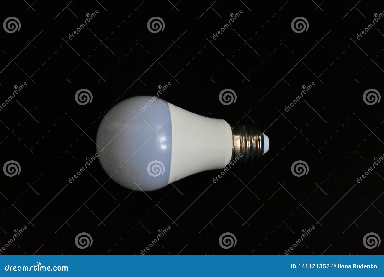 Closeup White Modern Light Bulb As an Example of the Progress of Production and Technology on a