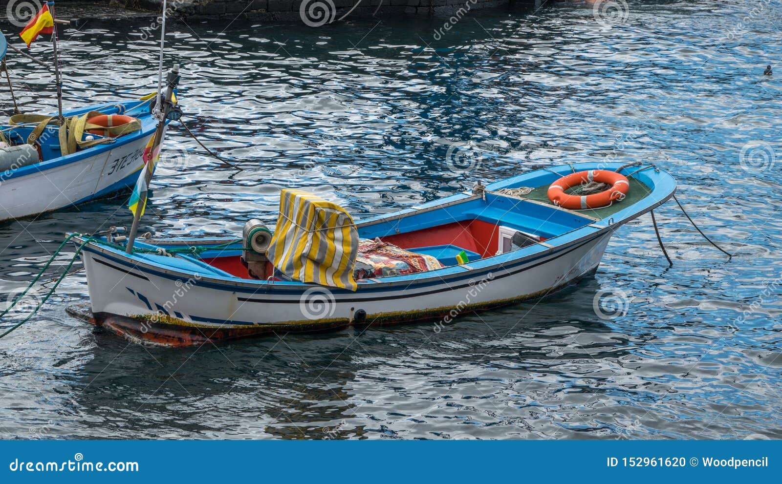 Closeup White Wooden Fishing Boat Moored In Glittering 