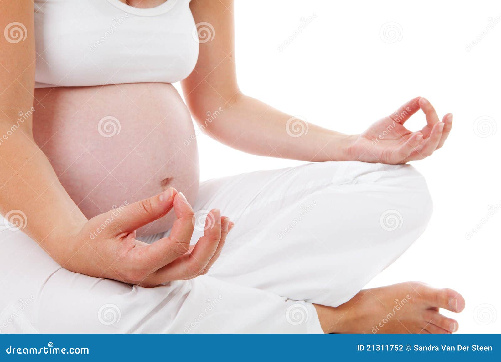 closeup of woman doing meditative pregnancy yoga