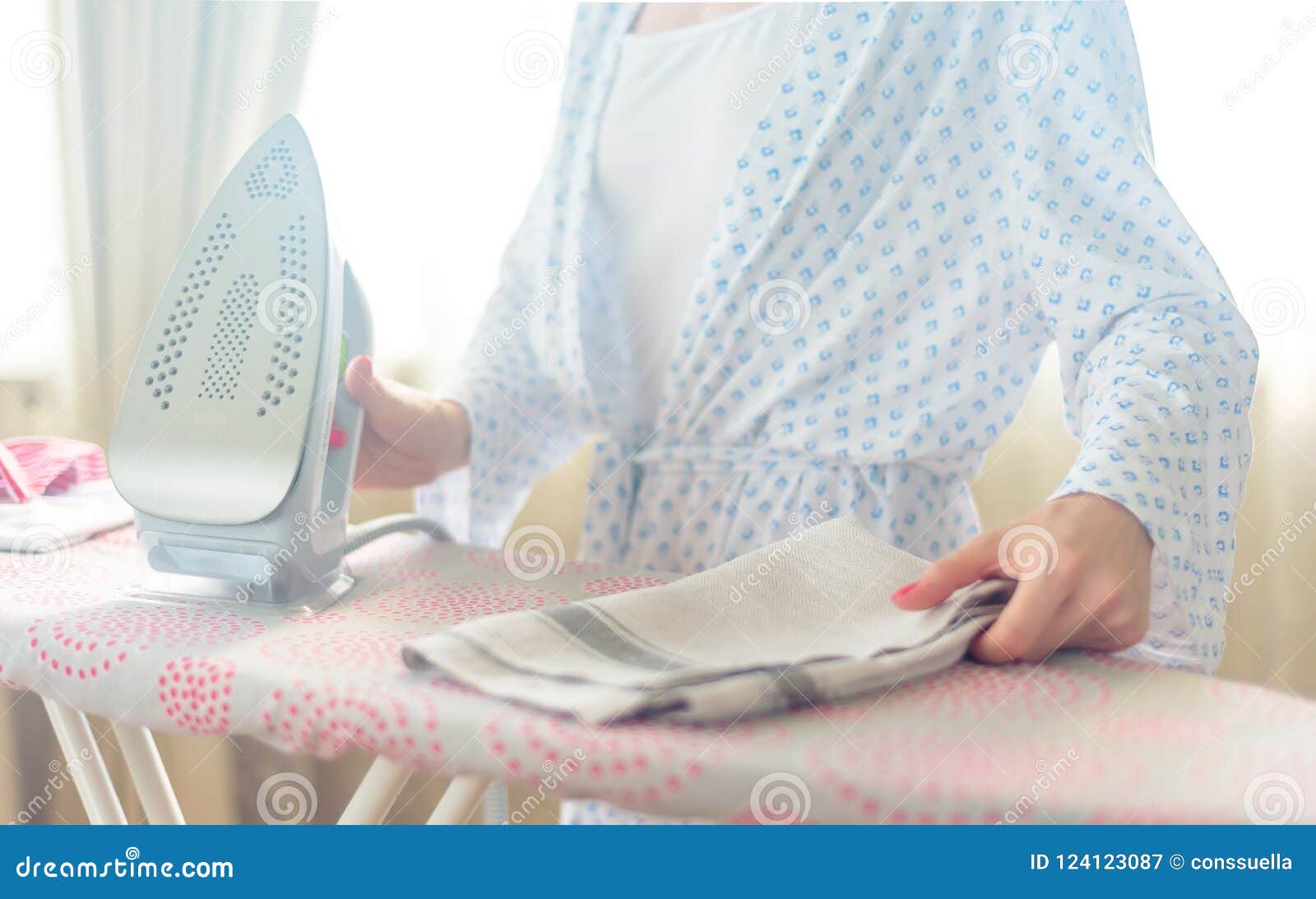 Closeup of Woman Ironing Clothes on Ironing Board Stock Image Image