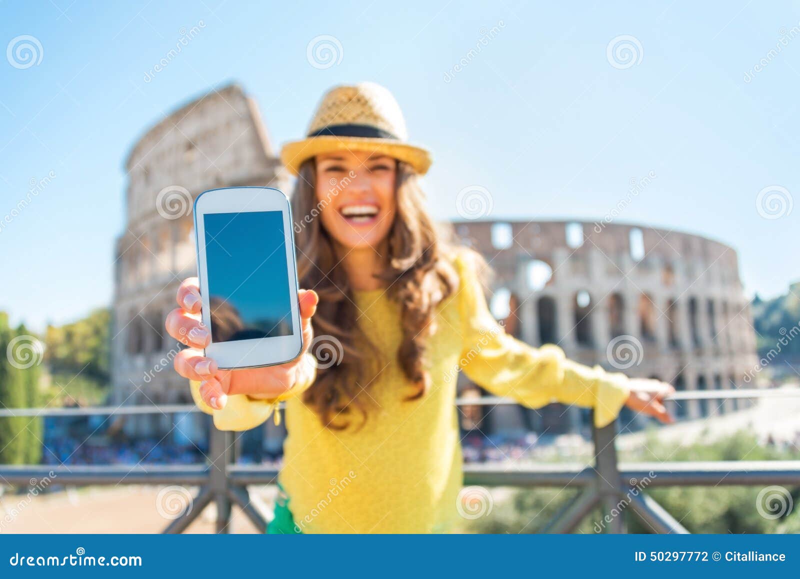 closeup on woman showing cell phone in rome