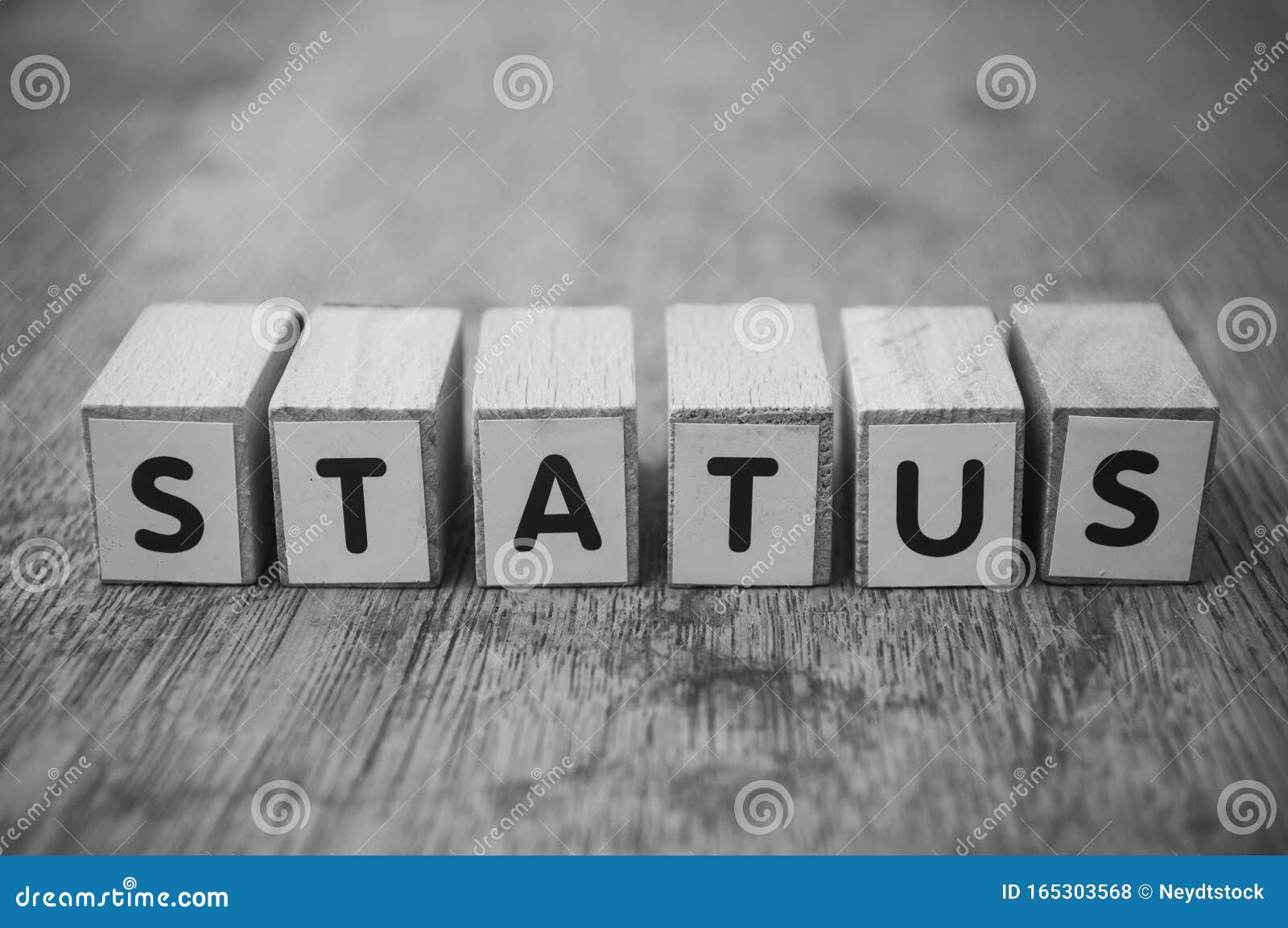 wooden word on wooden table background concept  - status