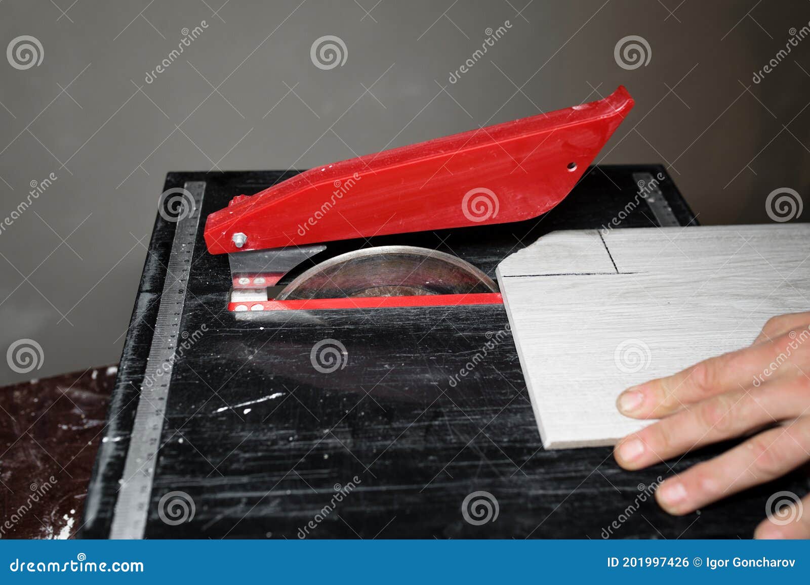 A Marking Tiles for Cutting with an Electric Tile Cutter Stock Photo Image of floor, machinery