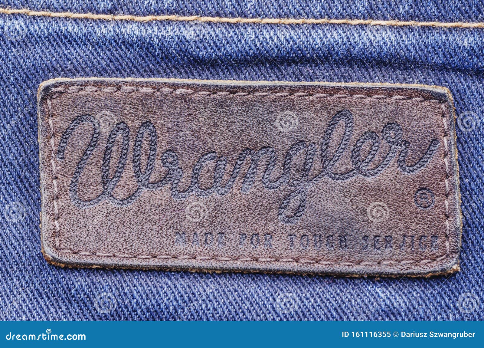 Closeup Of Wrangler  Label  On Blue Jeans Editorial Image 