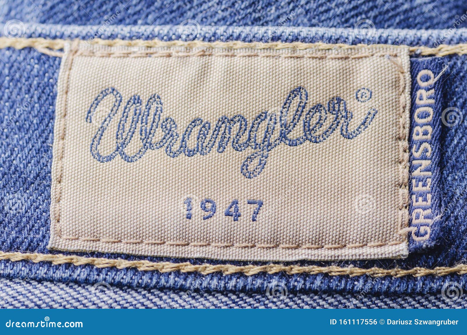 Closeup Of Wrangler  Label  On Blue Jeans Editorial Photo 