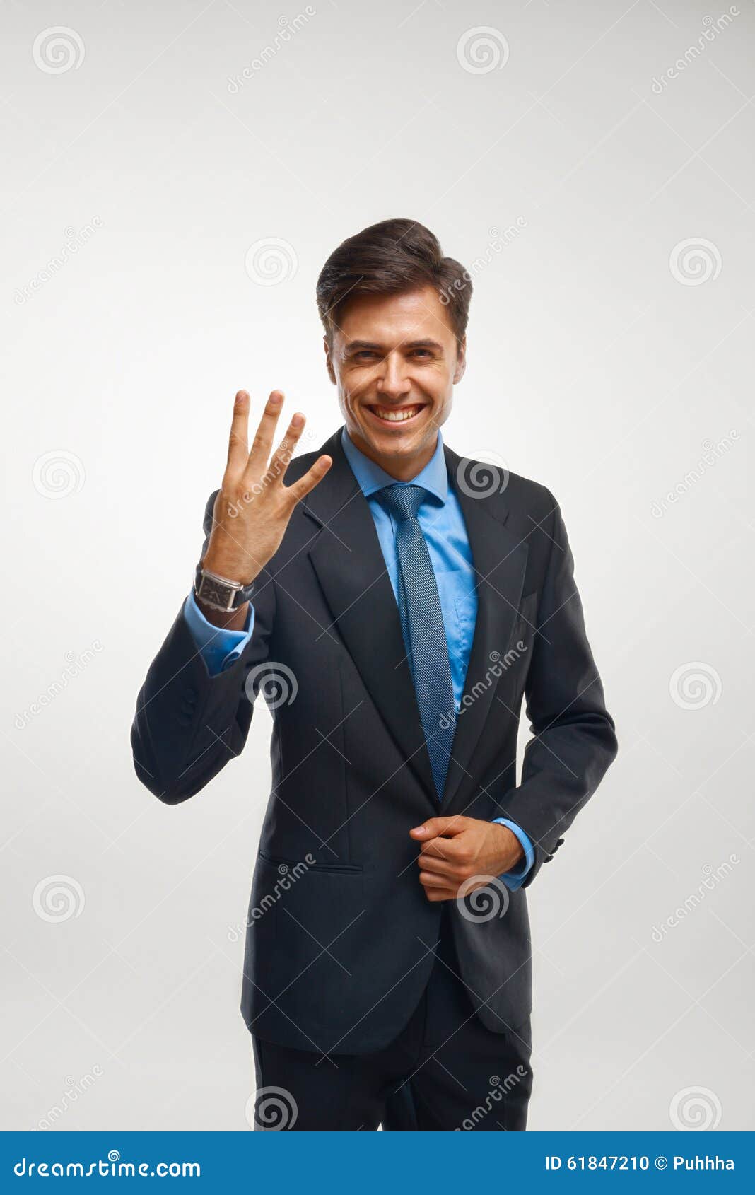 Closeup of a Young Business Man Showing Showing Numbers. Stock Photo ...
