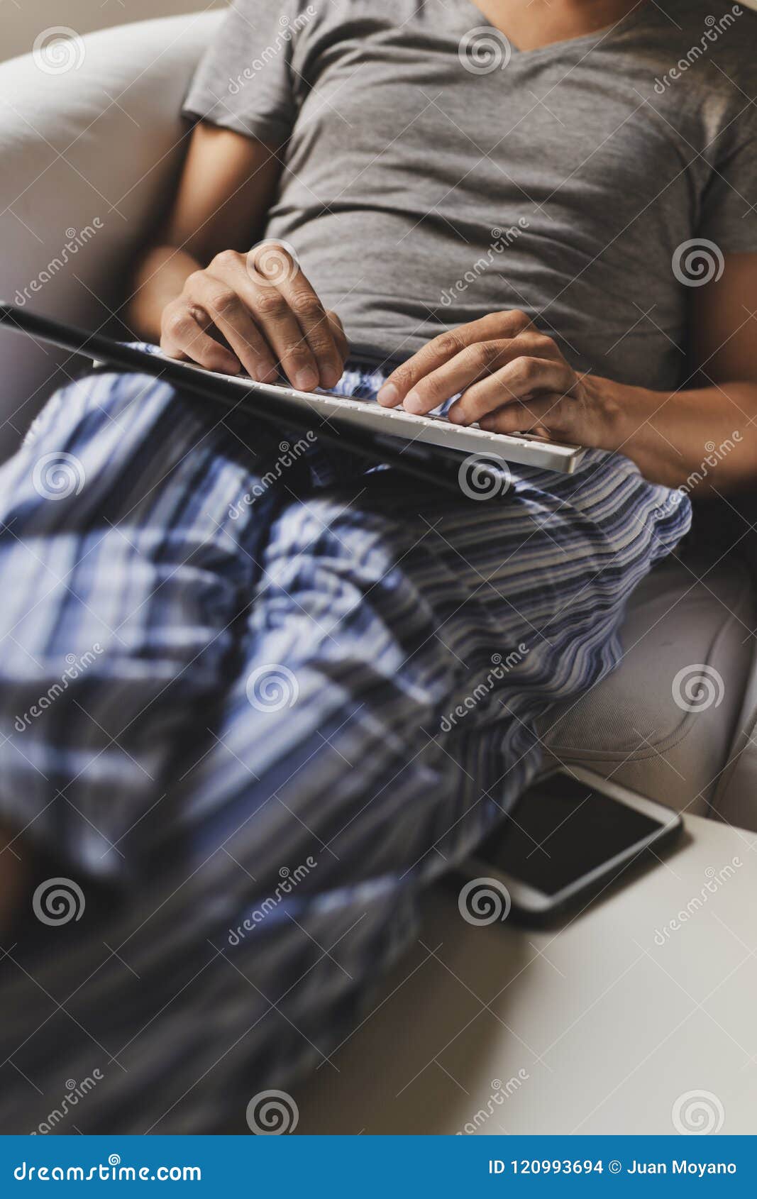 Man in Pajamas Using a Tablet Stock Photo - Image of relaxation, person ...