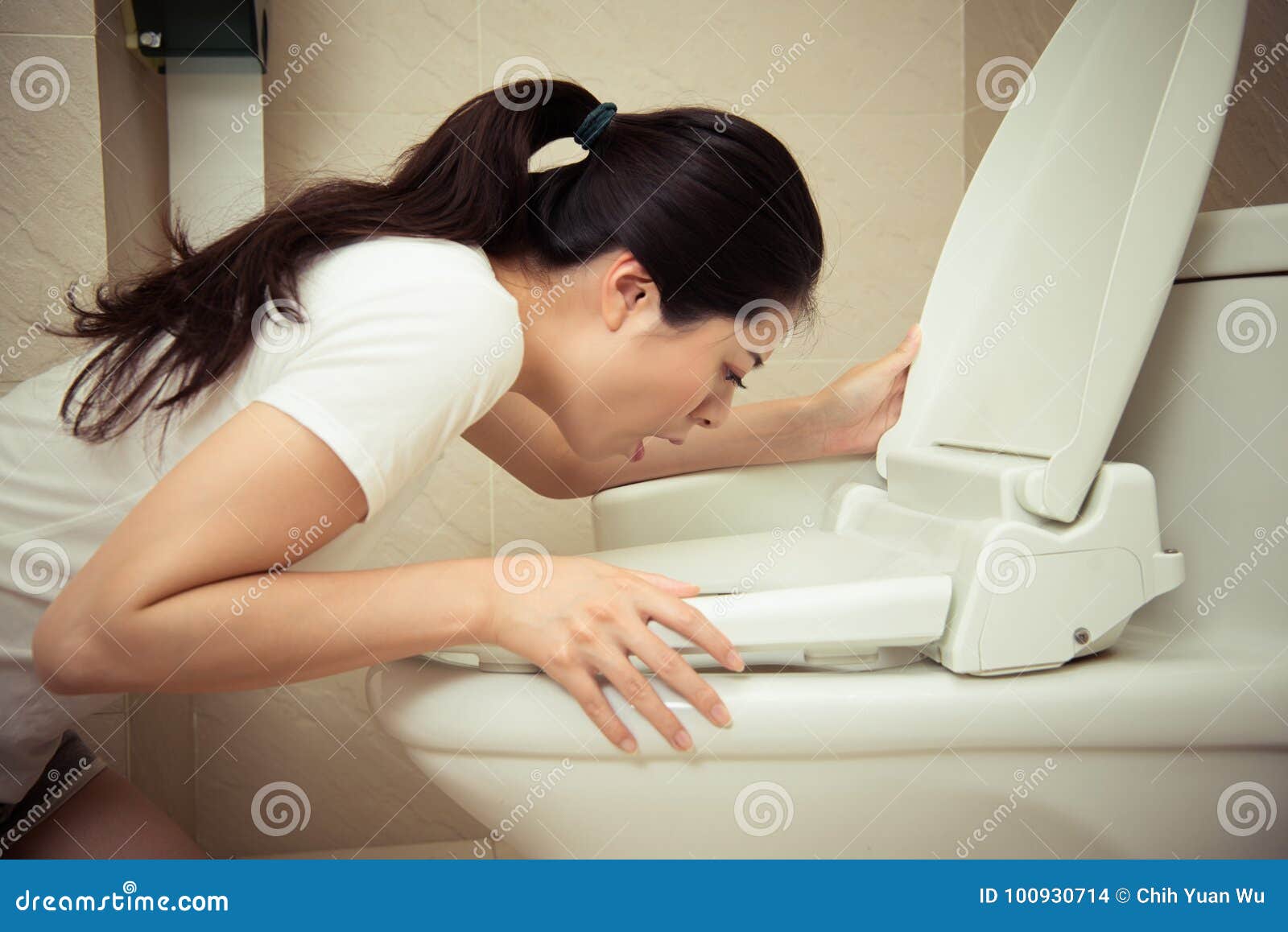 Woman Vomiting And Throwing Up Kneeling On Floor Of Toilet WC Guilty woman-vomiting-and-throwing-up-kneeling-on-floor-of-toilet-wc-guilty