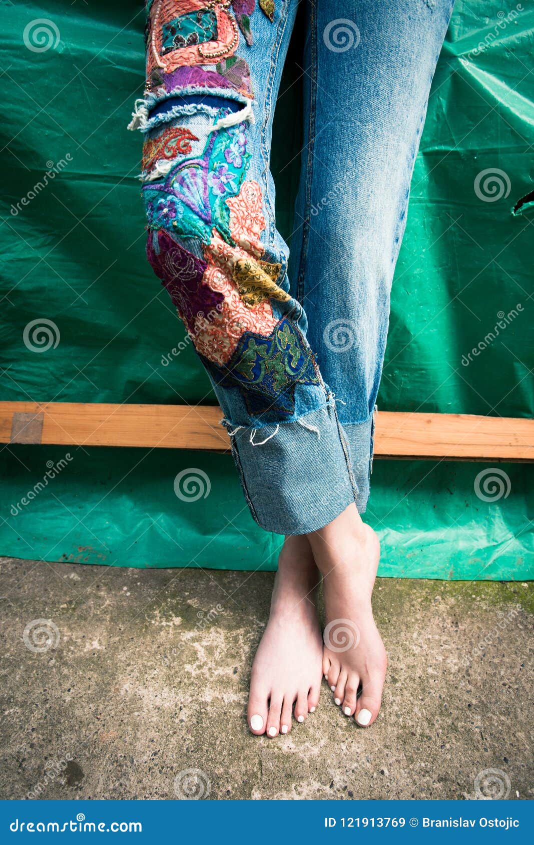 https://thumbs.dreamstime.com/z/closeup-young-woman-barefoot-legs-boho-style-jeans-co-closeup-young-woman-barefoot-legs-boho-style-jeans-121913769.jpg?ct=jpeg