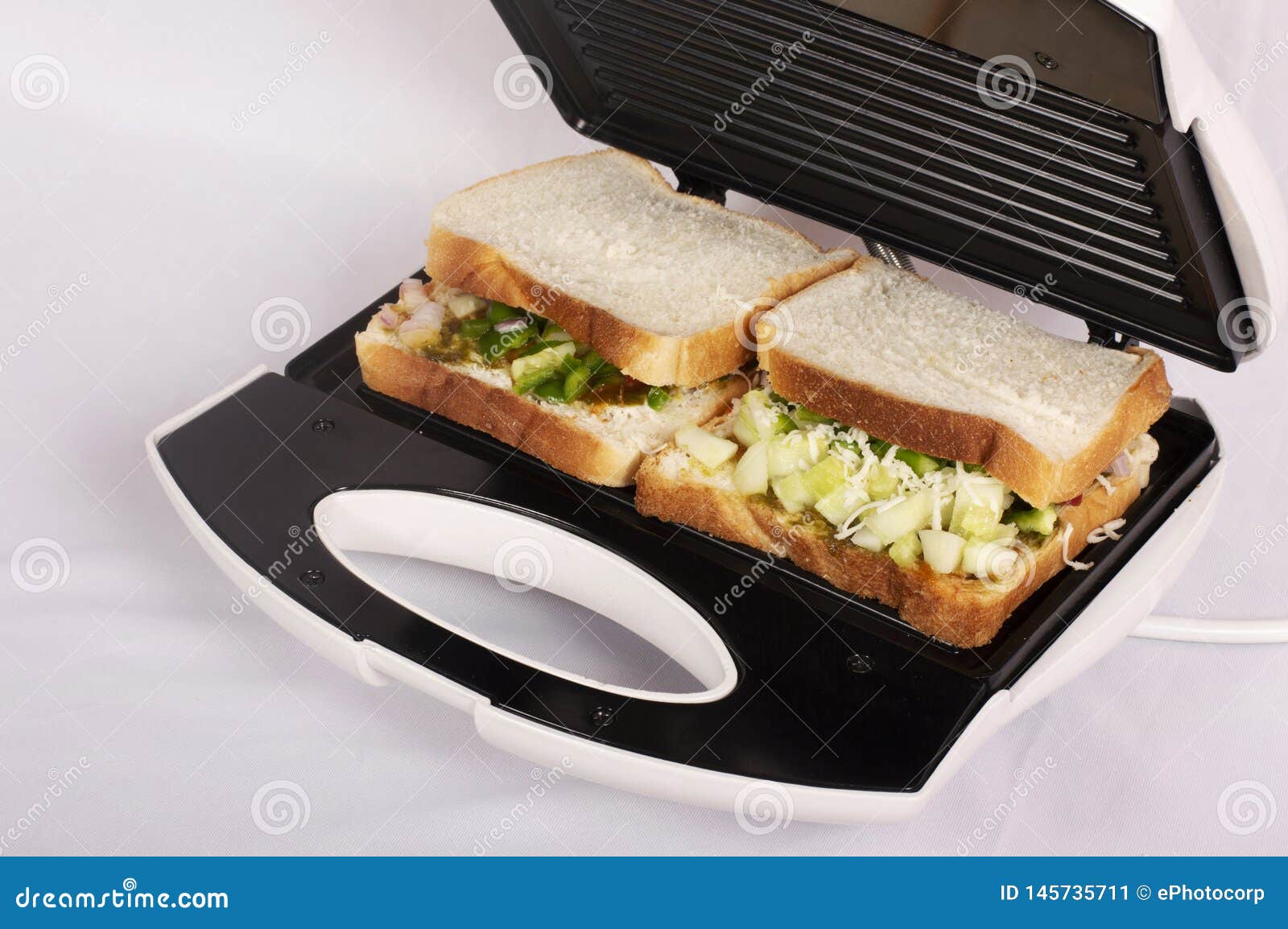 Closeview, Sandwich Toaster with Toast and Ingredients Stock Image