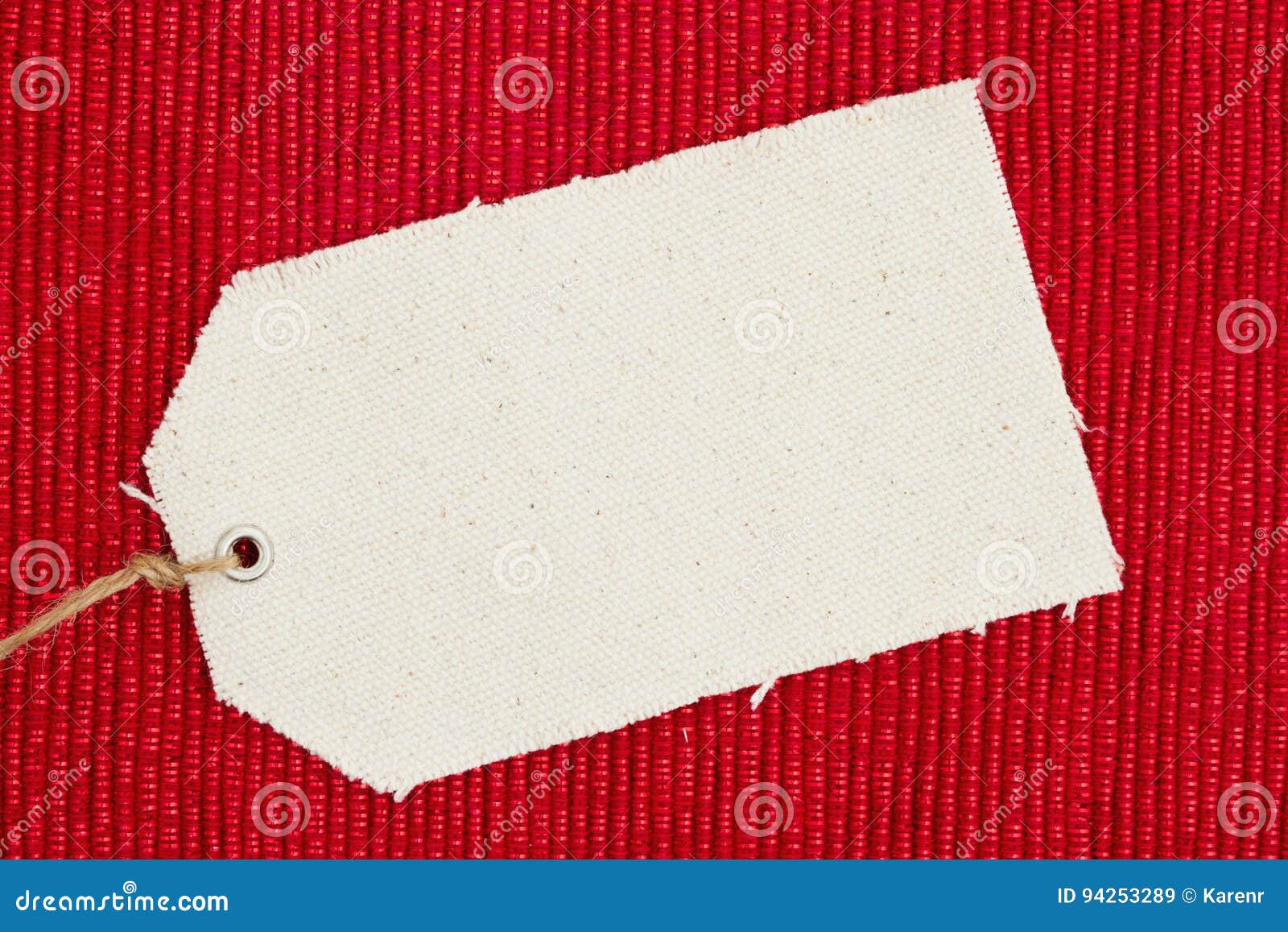 a cloth gift tag on shiny red material