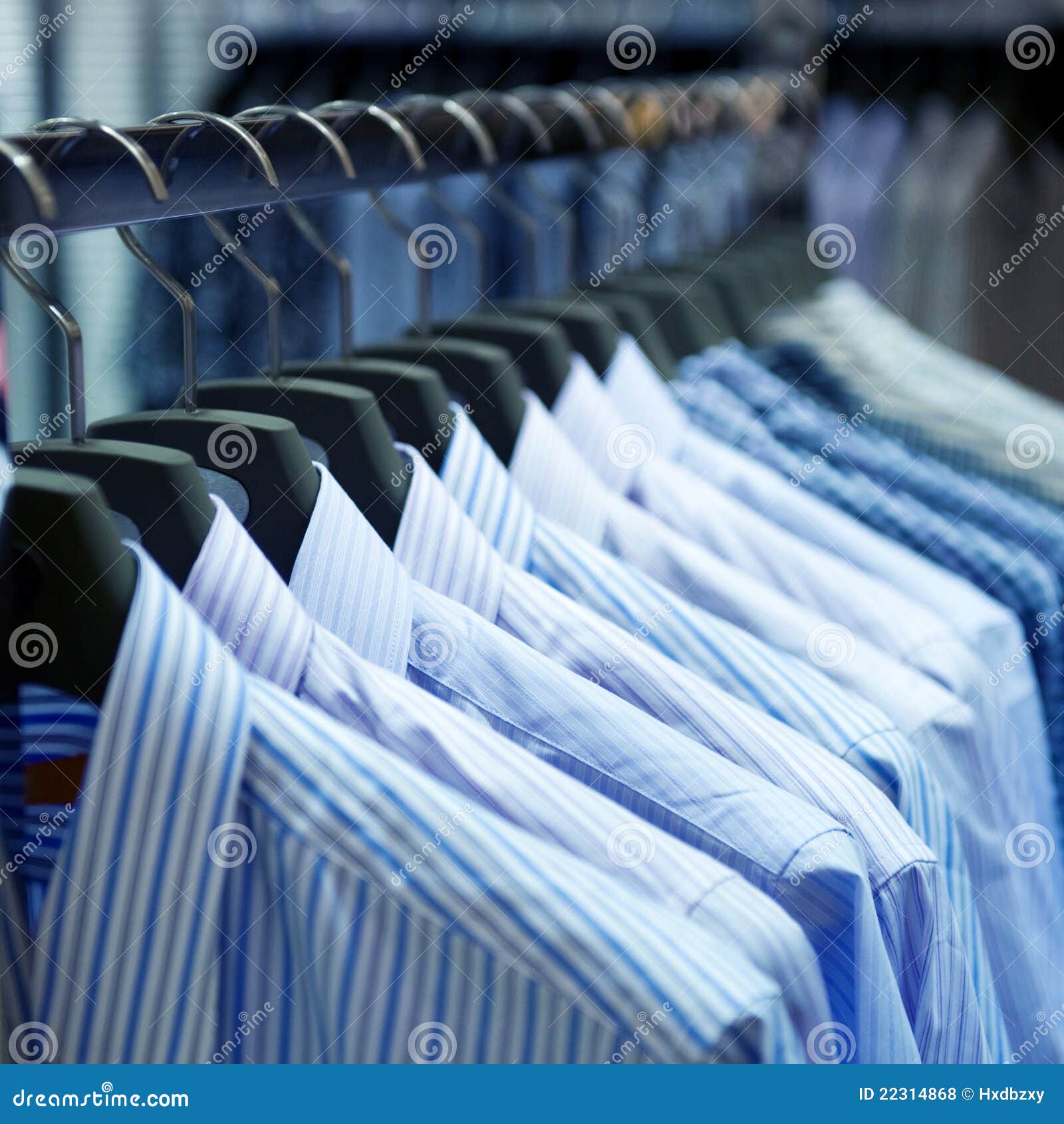 Cloth hangers with shirts stock photo. Image of fashion 22314868