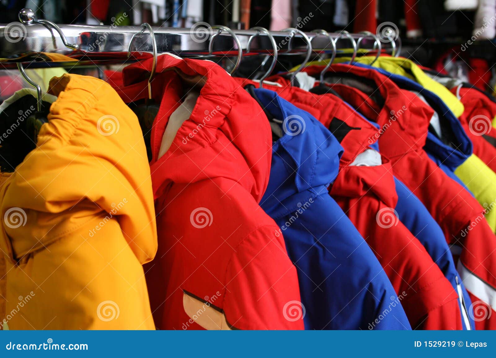 coats on rack in shop