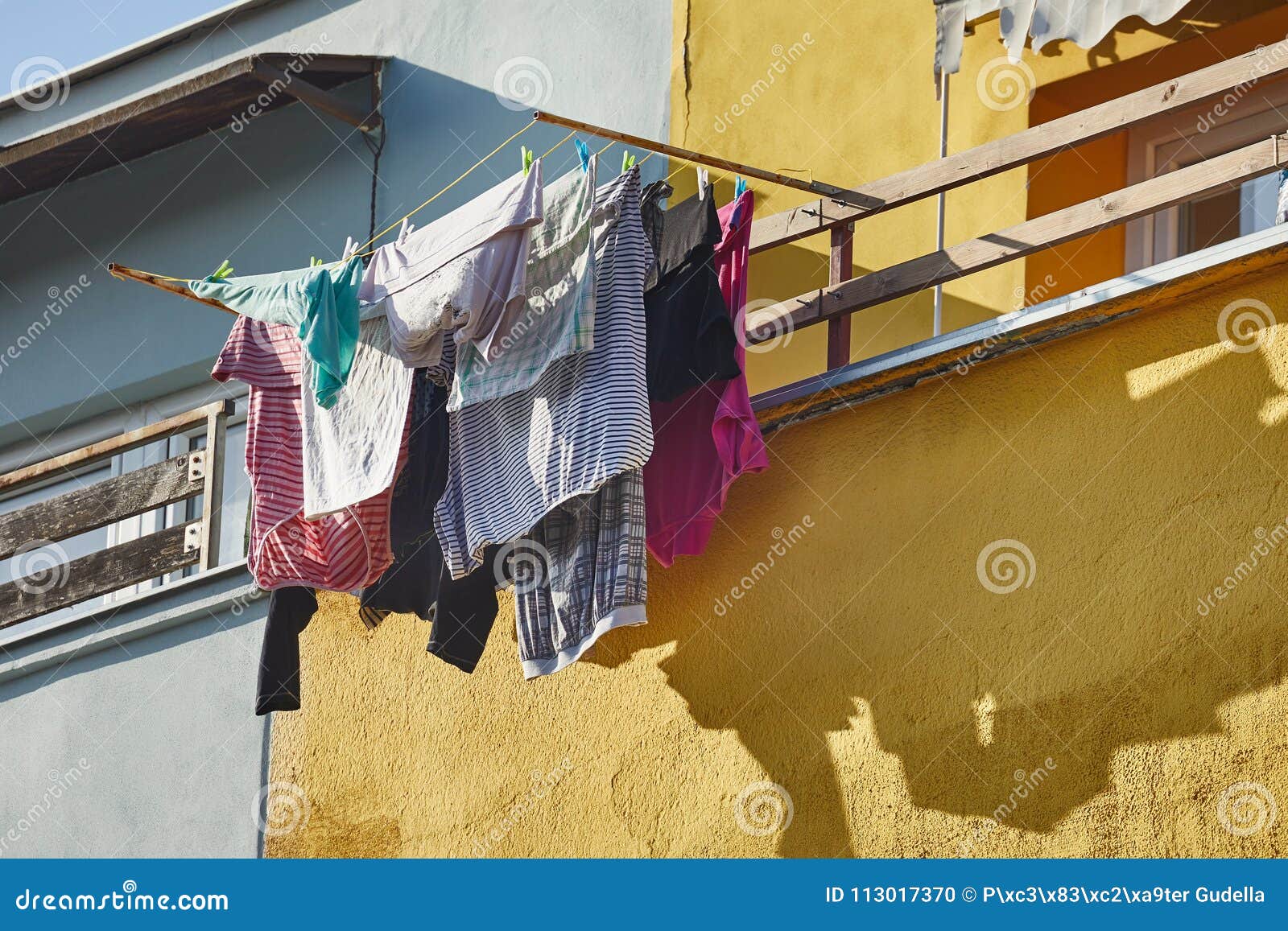 Clothes Hanging Outside stock photo. Image of home, building 113017370
