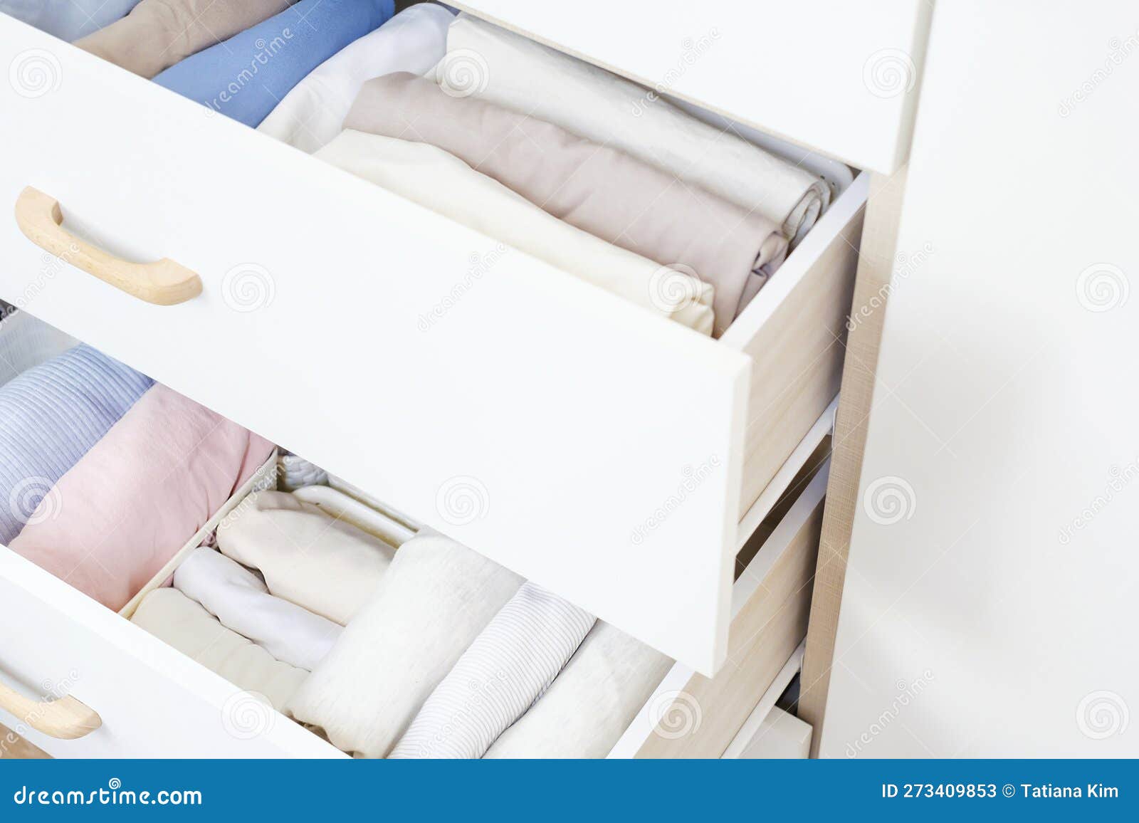 Clothes Folded in a Box in a Dresser Closeup, Space Organization