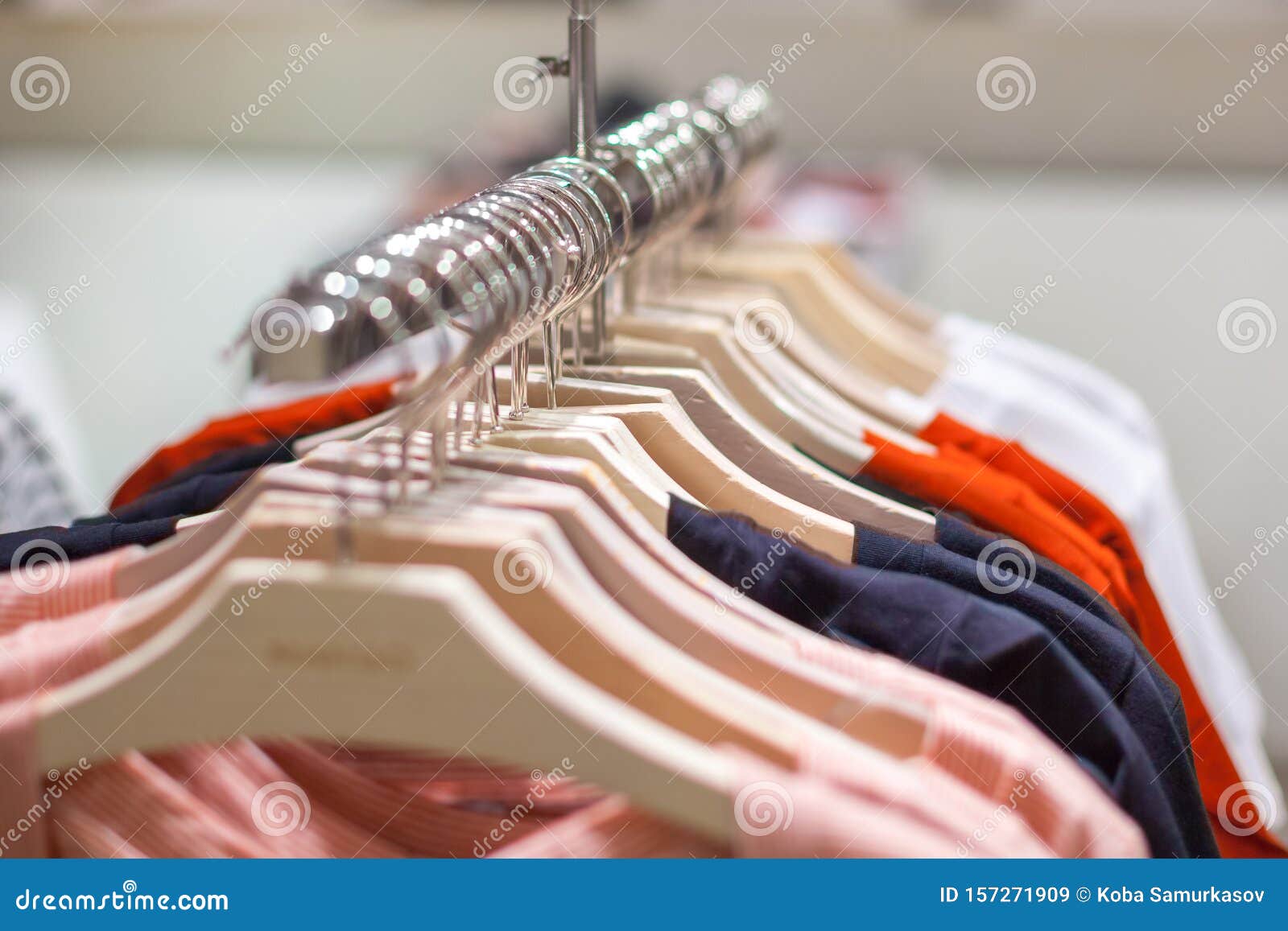 Clothes Hang on a Shelf. Clothes Hanger Showcase in Store Shopping ...
