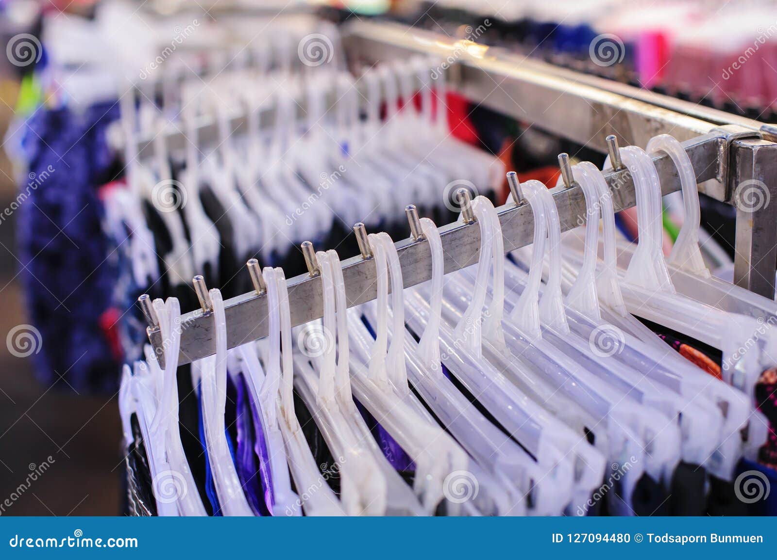 Clothes Hang on Shelf in a Clothing Store Stock Photo - Image of ...