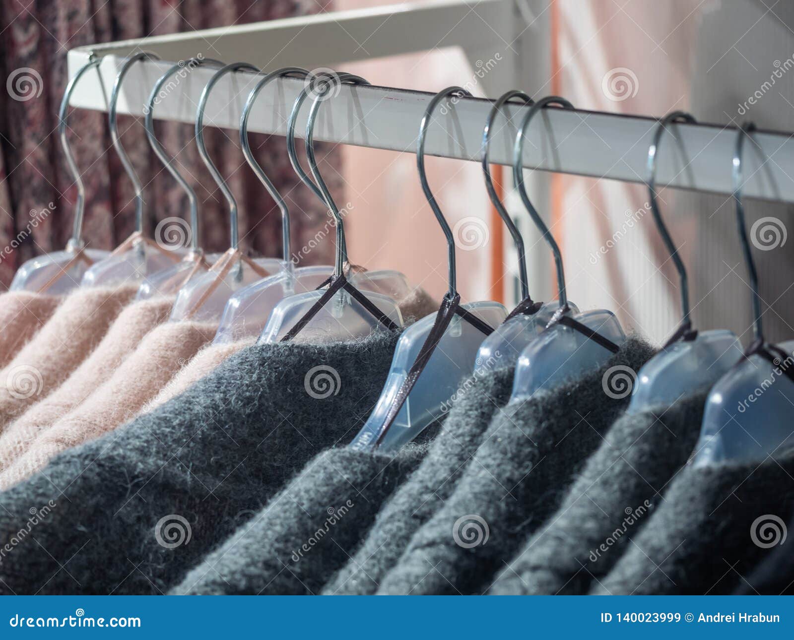 Clothes Hang on a Shelf in a Designer Clothes Store Stock Image - Image ...