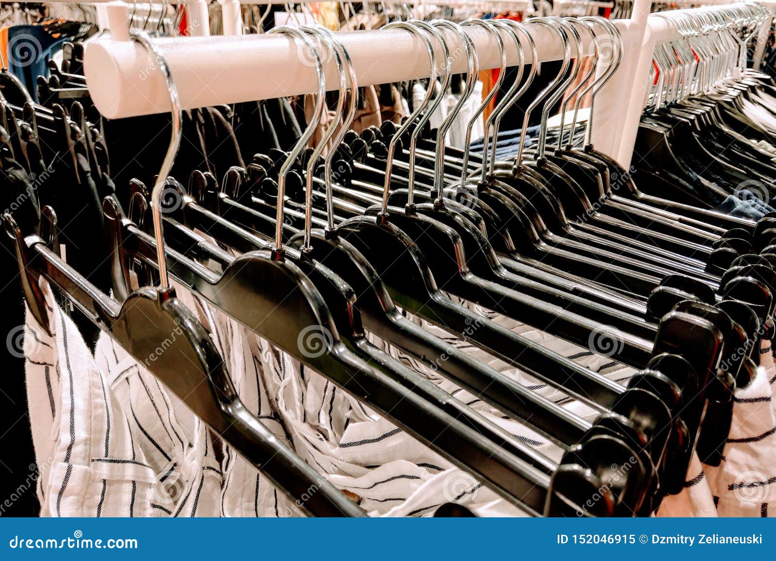 Clothes Hang on a Shelf in a Designer Clothes Store Stock Image - Image ...