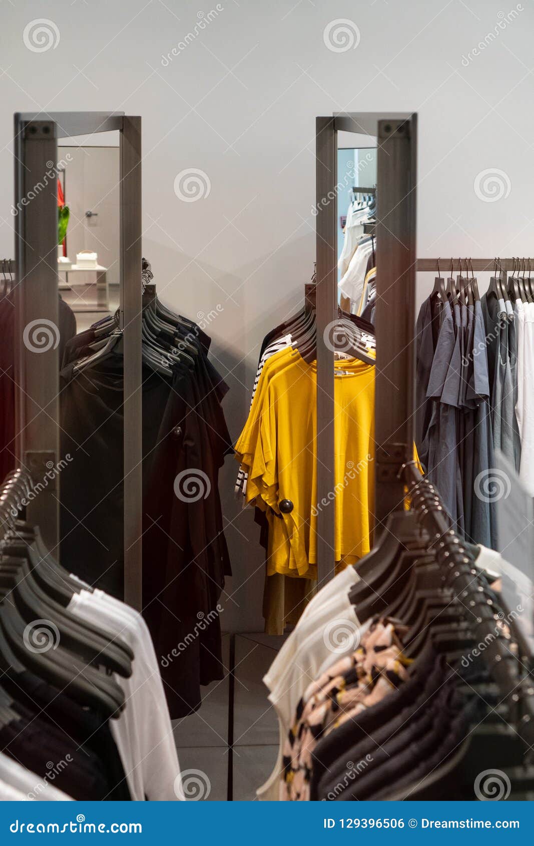 Clothes on hanger in store stock photo. Image of hanger 129396506