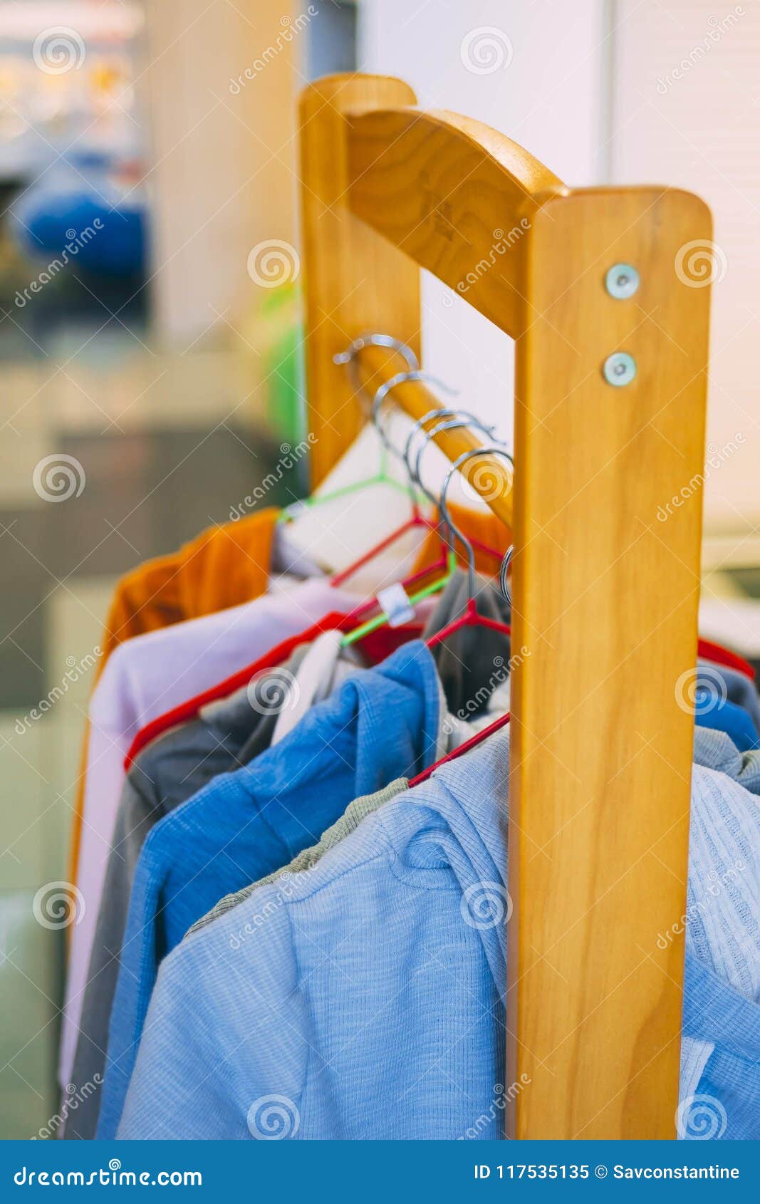 Clothes on hangers stock image. Image of lifestyle, equipment - 117535135