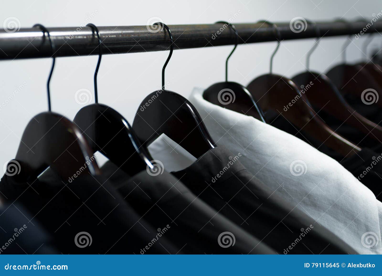 Clothes on Hangers in Store Stock Image - Image of black, metal: 79115645