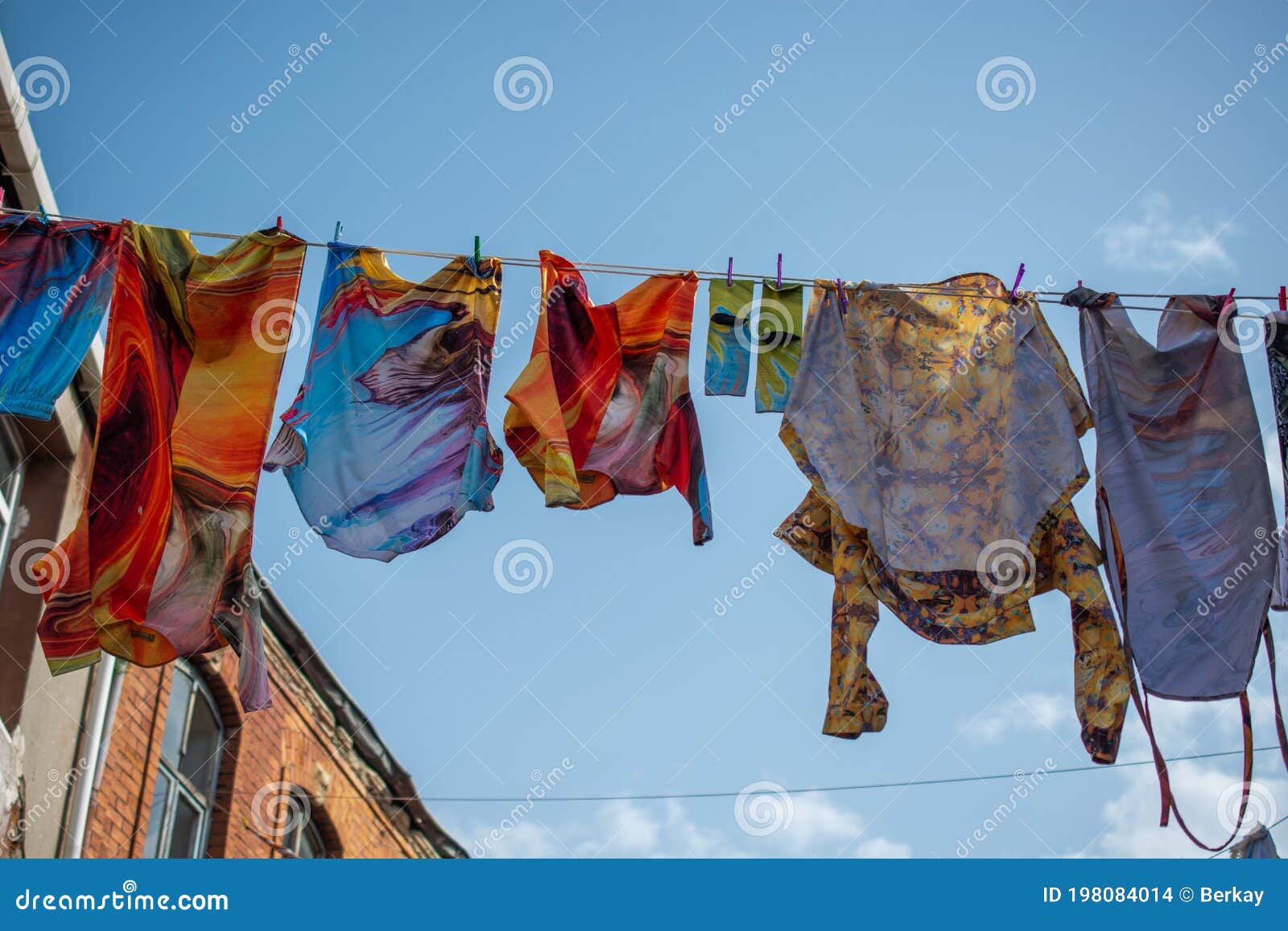 Clothes Hanging from a Clothes Line Rope in a Street Stock Photo