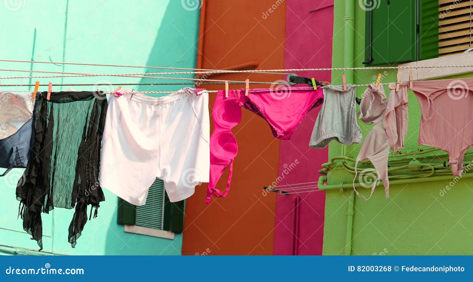 Clothes and Underwear Lying in the Sun To Dry Stock Photo - Image of  knickers, market: 82003268