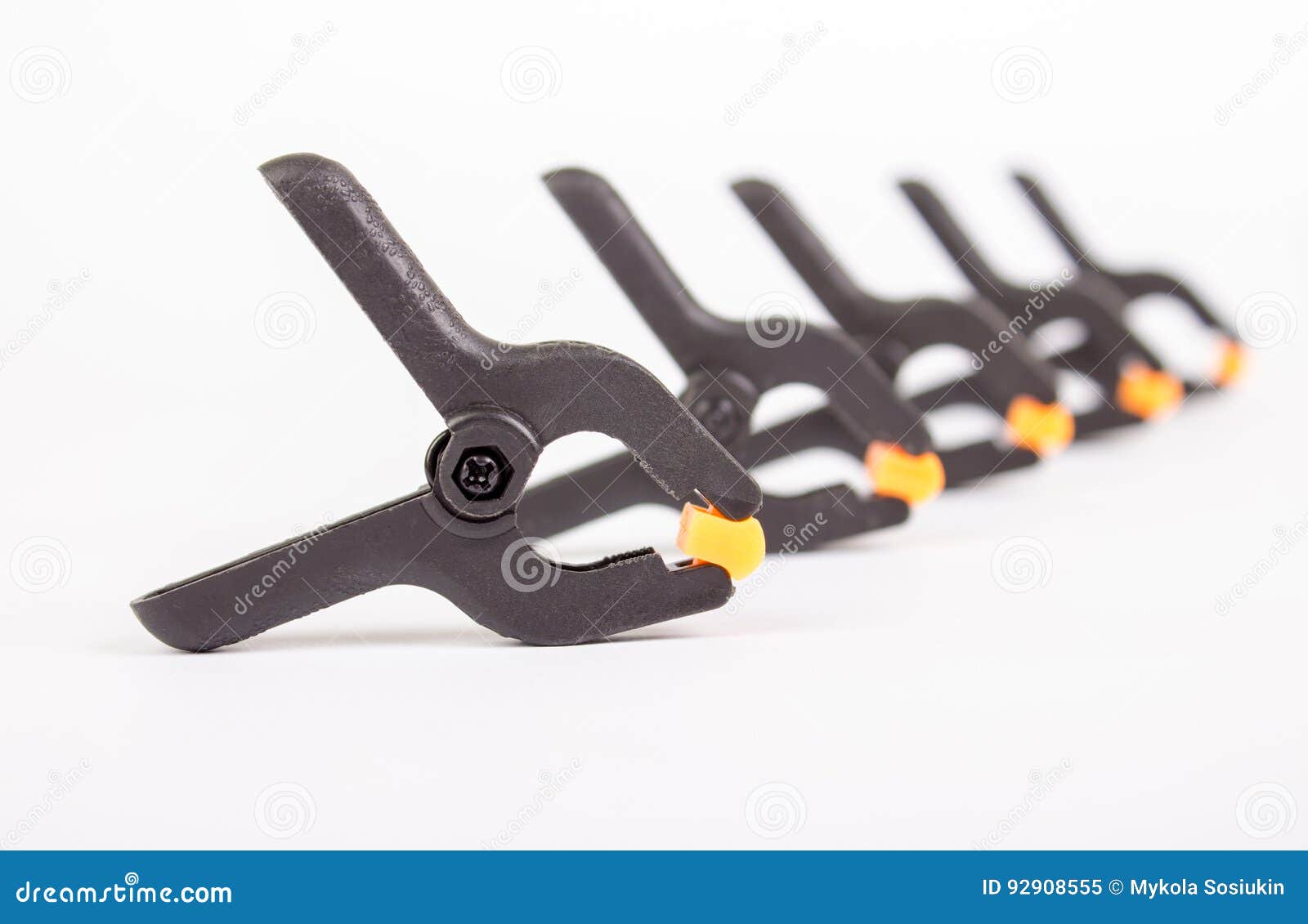 Clothespin. Carpentry Clamps. Plastic Clothespin on a White. Stock