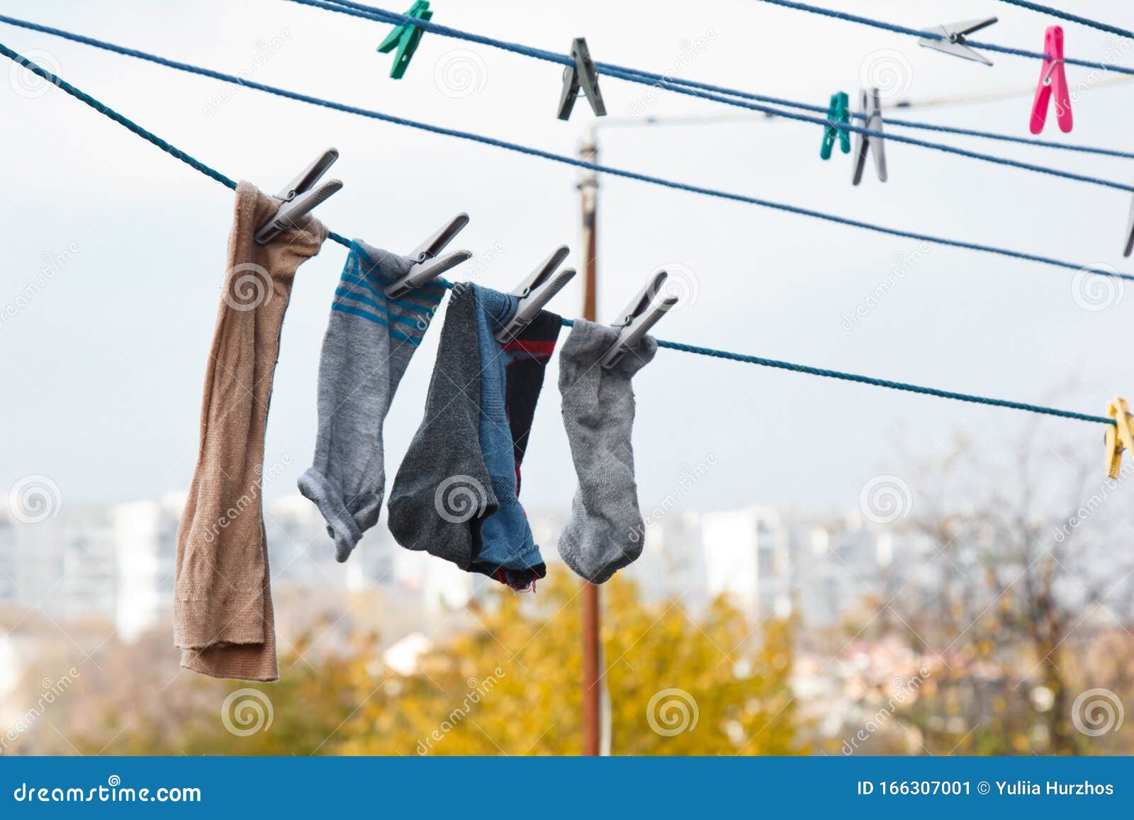 A Clothespin Hangs on the Washing Line. a Rope with Clean Linen