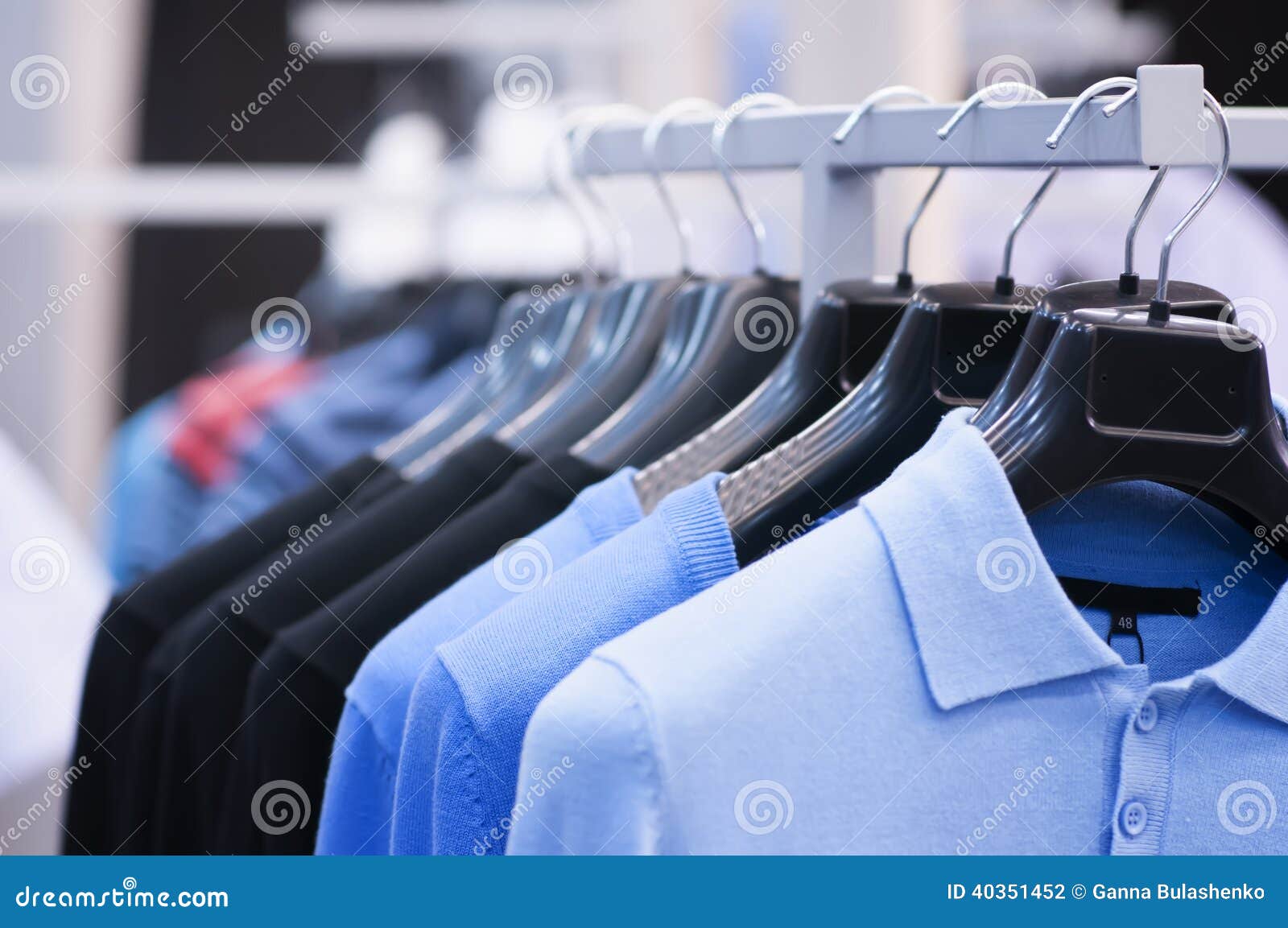 Clothing on Hangers at the Boutique. Stock Photo Image of wardrobe