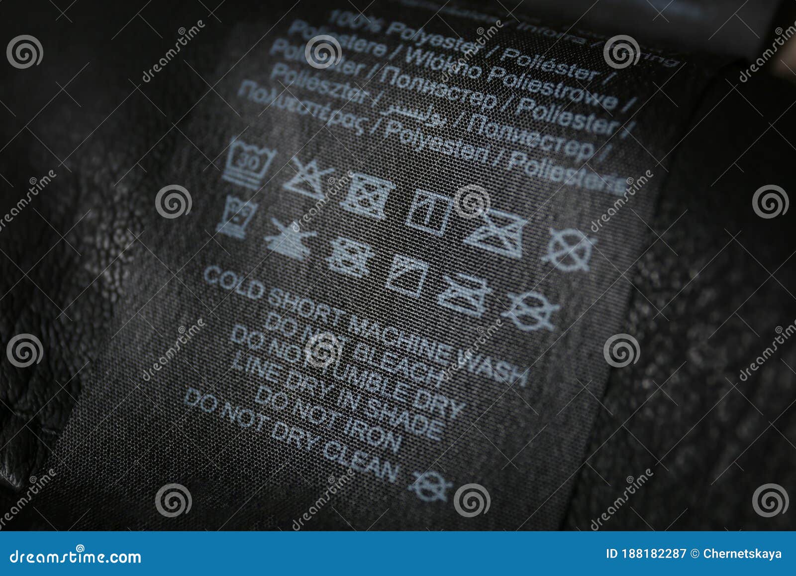 Clothing Label with Care Symbols and Material Content on Black Shirt ...