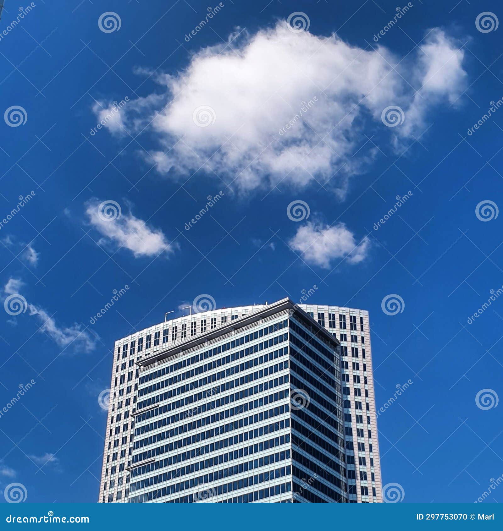 cloud and blue sky over skyscrapper top