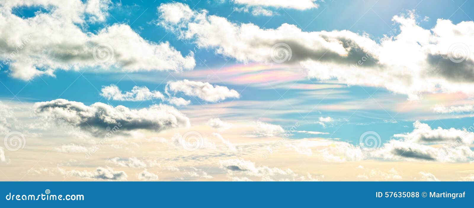cloud iridescence in blue sky, effect of sunlight
